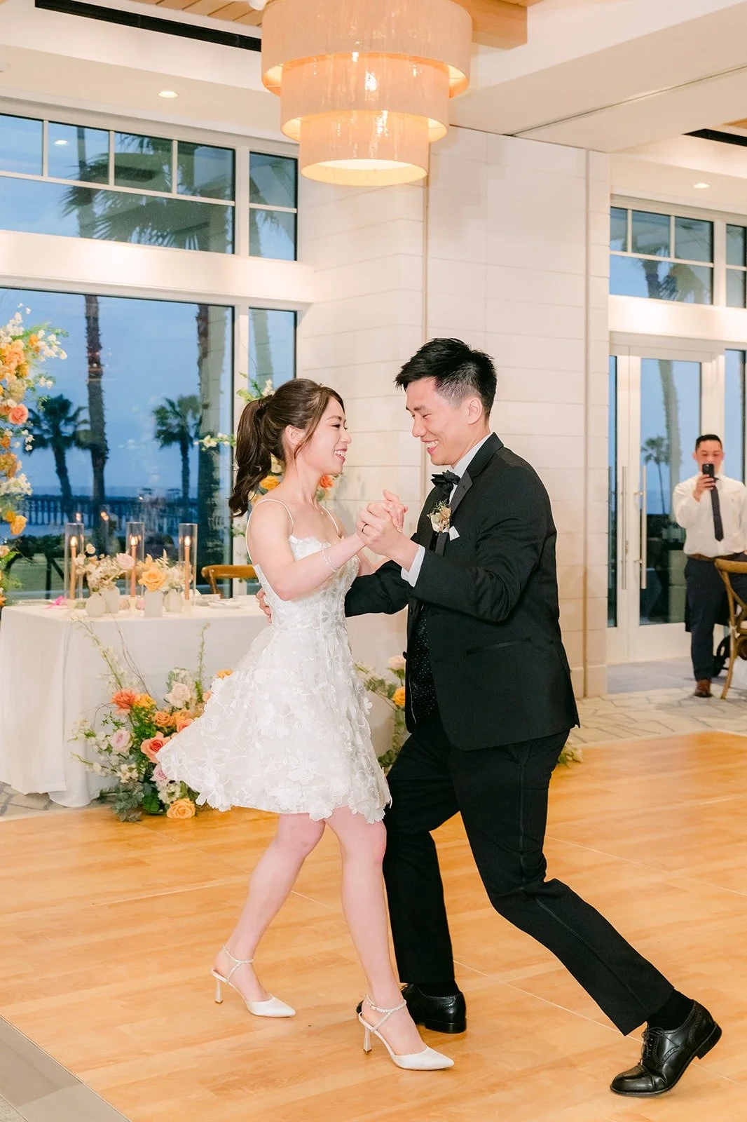 Eli spinning Angela across the ballroom floor