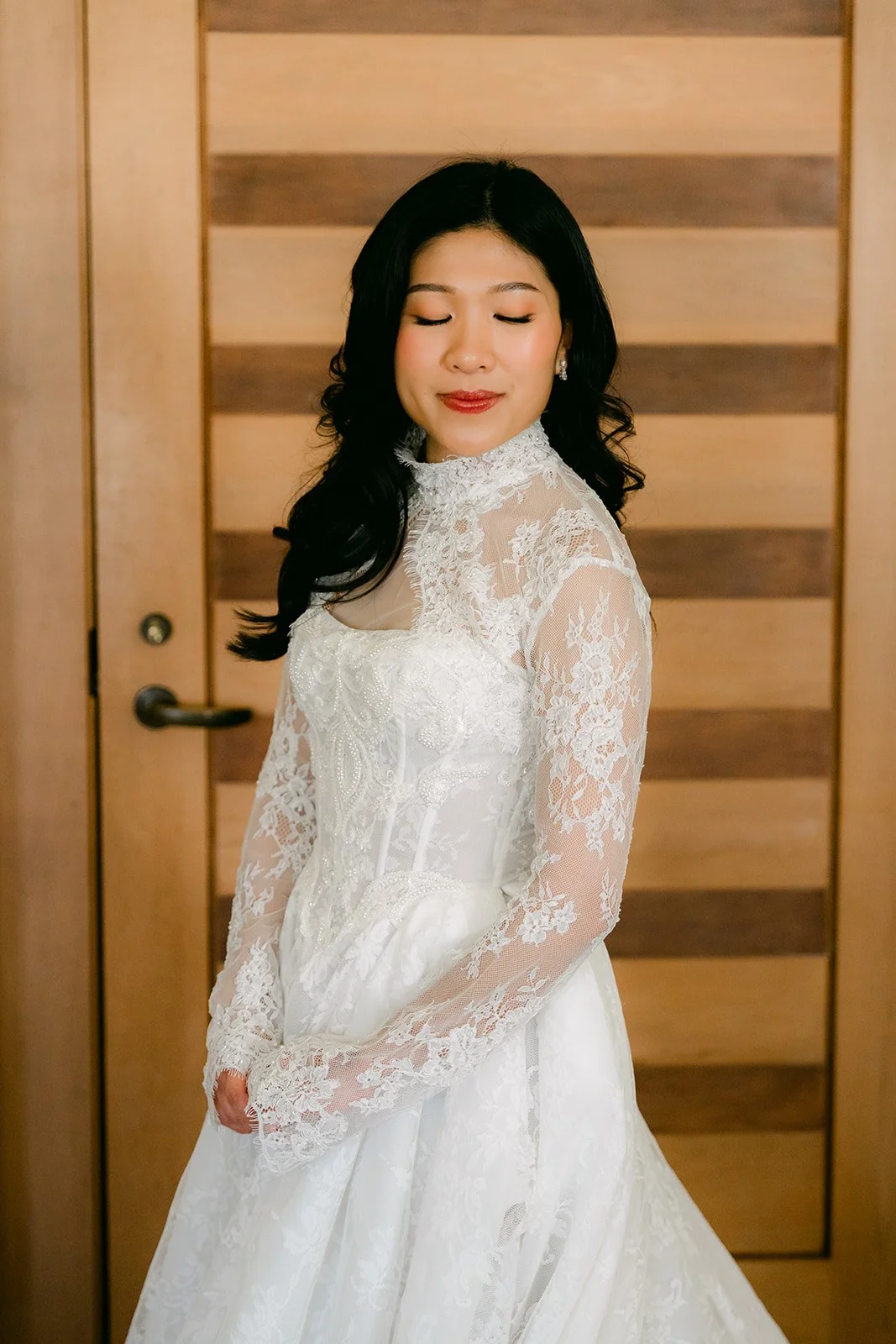 Kim in her high-neck lace gown in the bridal suite