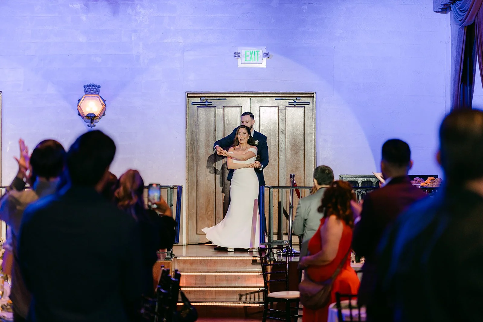 Mariana and Danny making their grand entrance at the top of the stairs