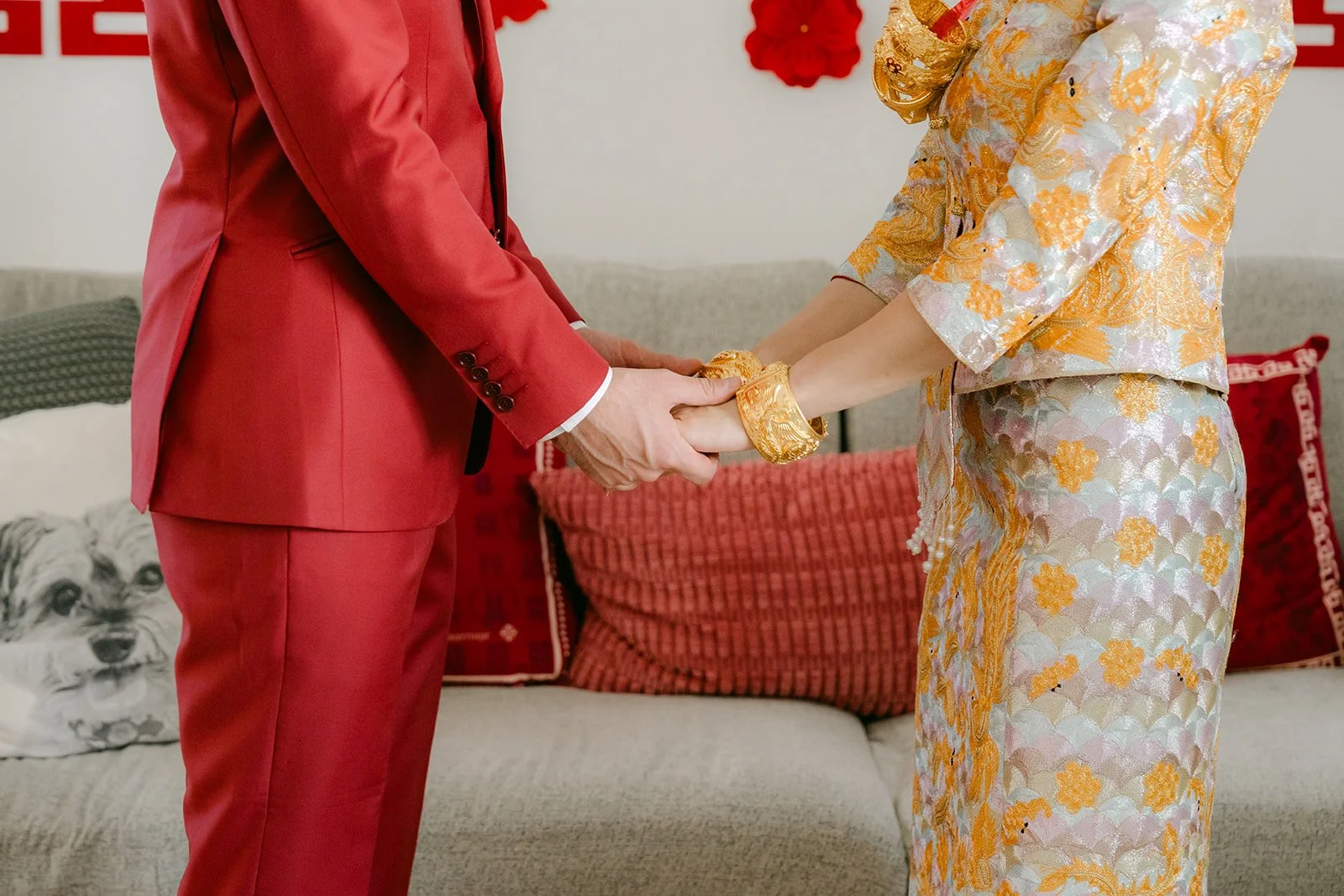 Christie and Christian holding hands after serving tea.