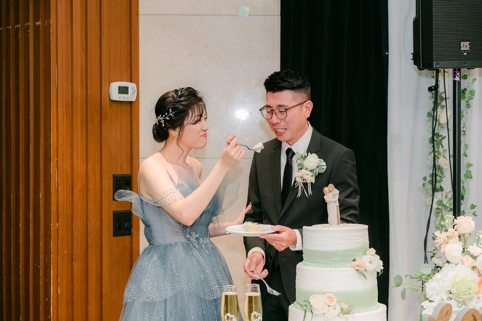 Eunice feeds Eric a bite of cake