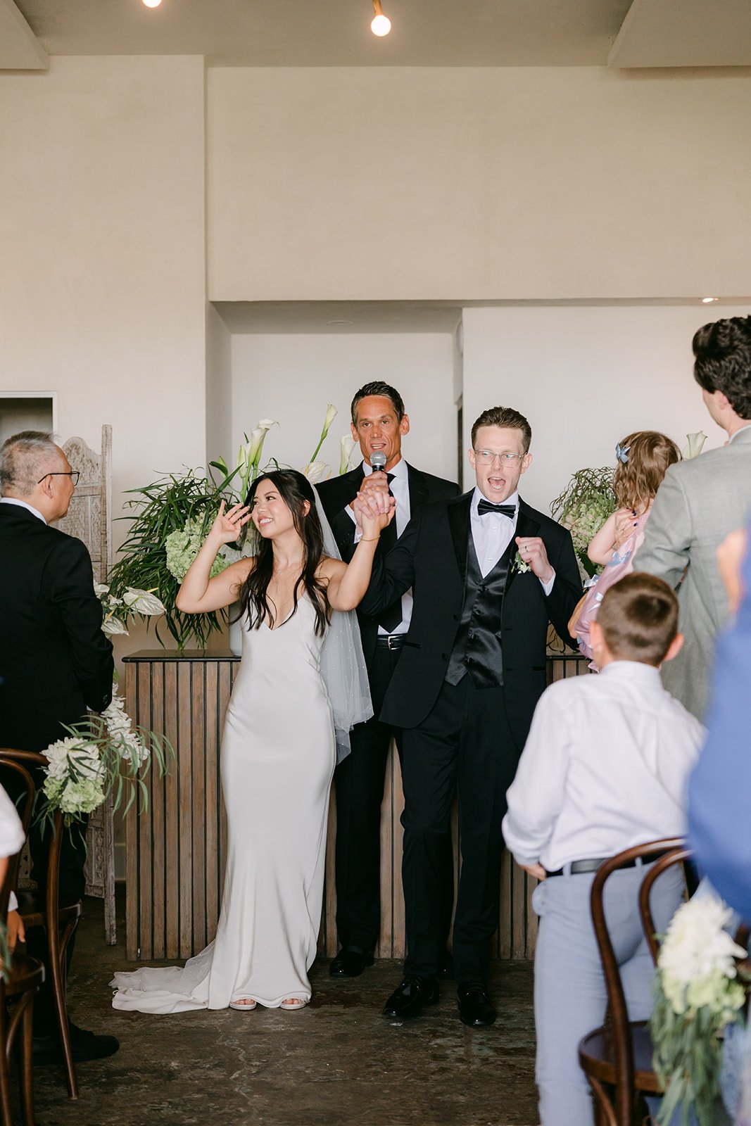 Justine and Matthew celebrating after the ceremony
