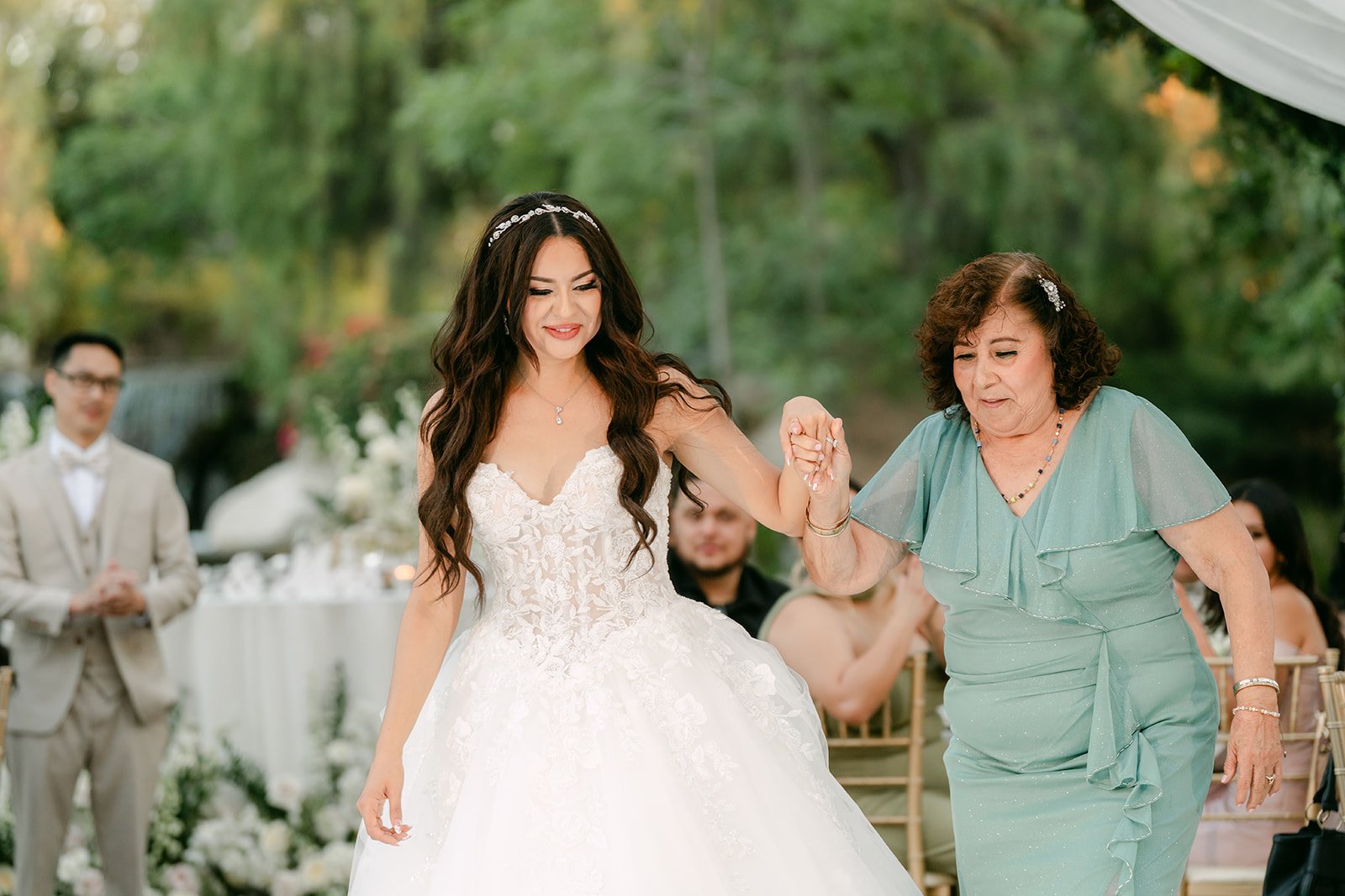 Sandra dancing with her grandmother as Kevin looks on.