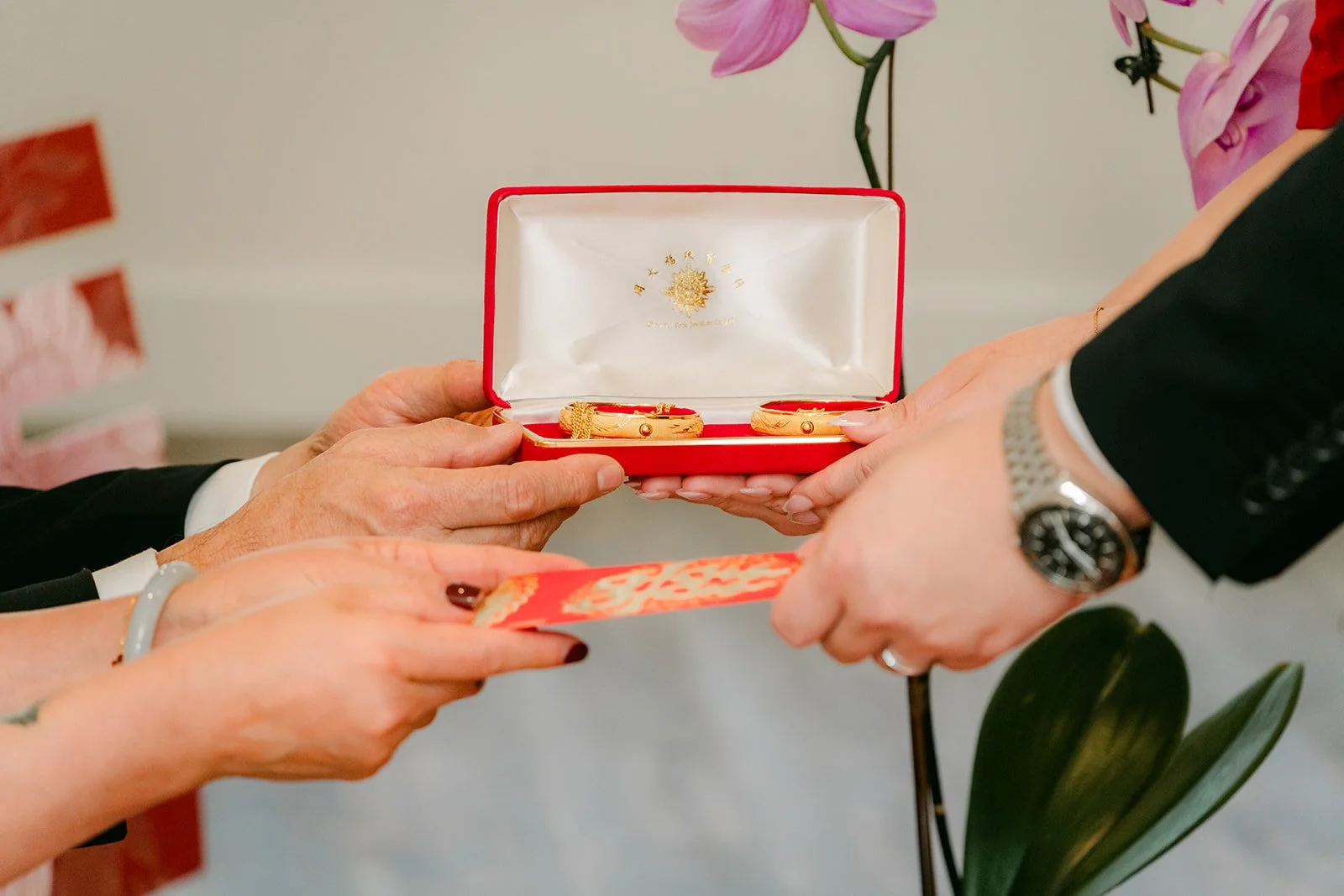Gold jewelry presented in a box.