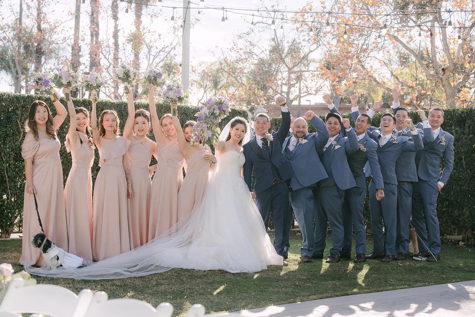 The wedding party cheering with Kate and Michael.