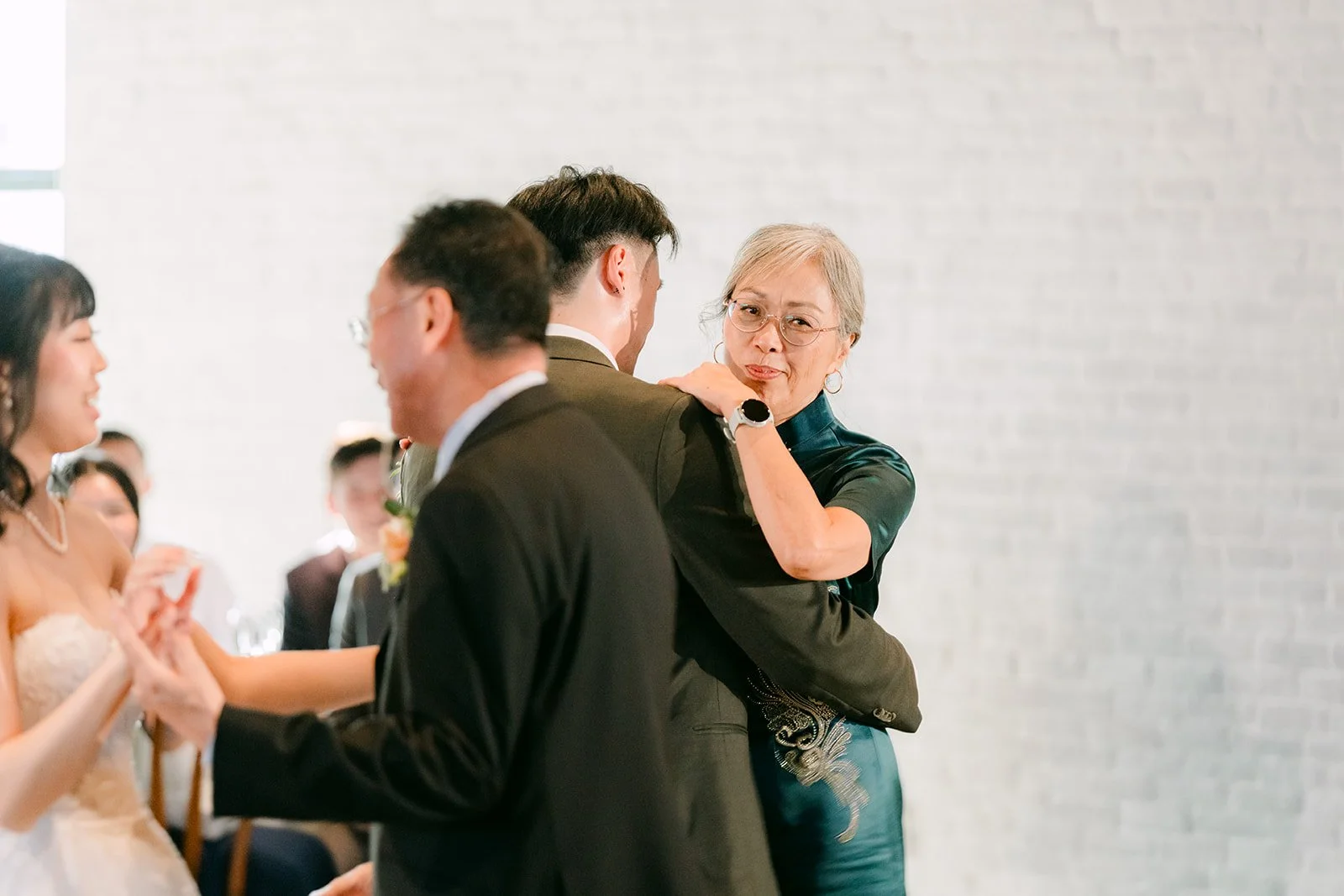 Parents joining the couple on the dance floor