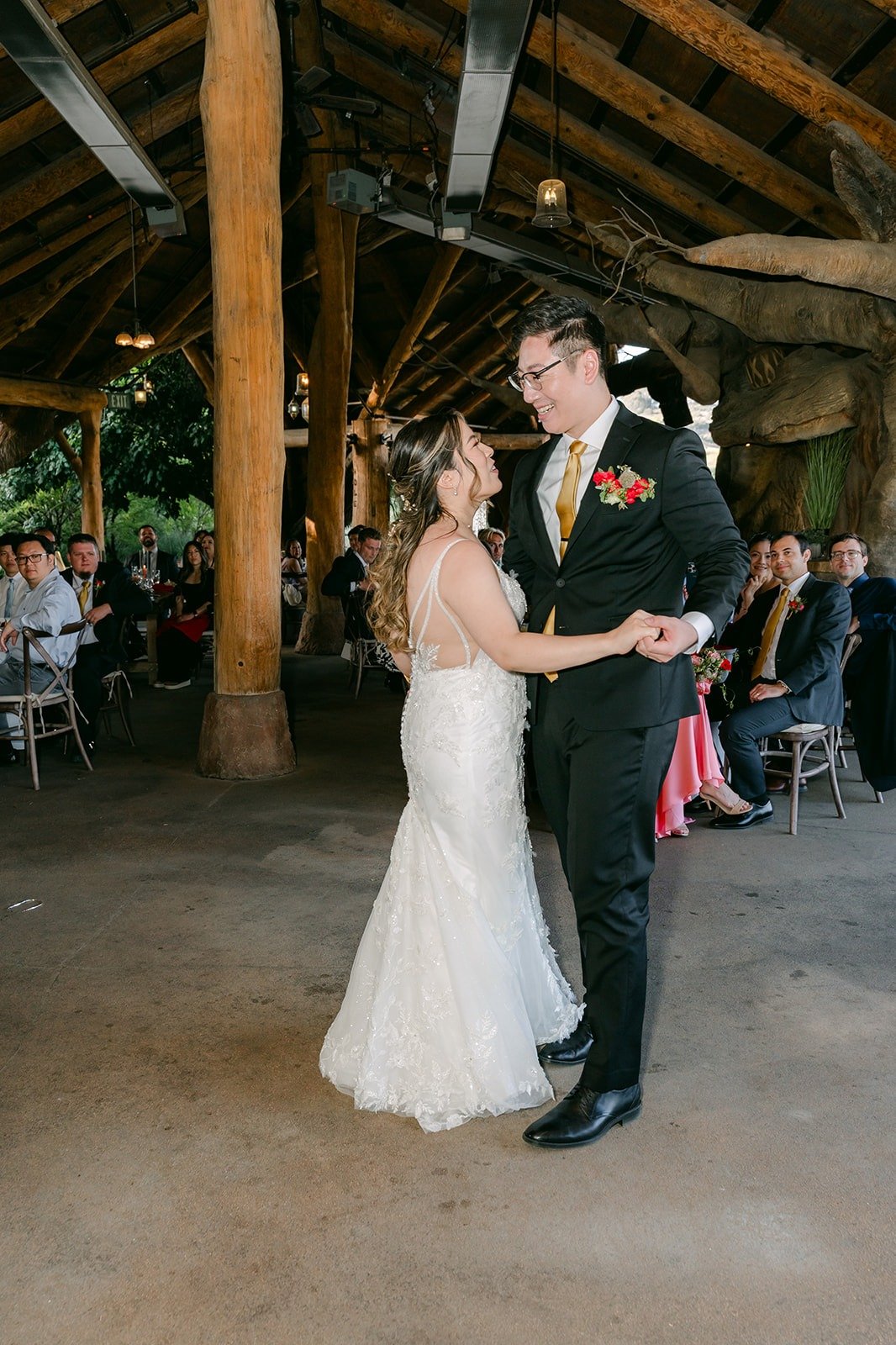 Joanne and Zach smiling through their first dance
