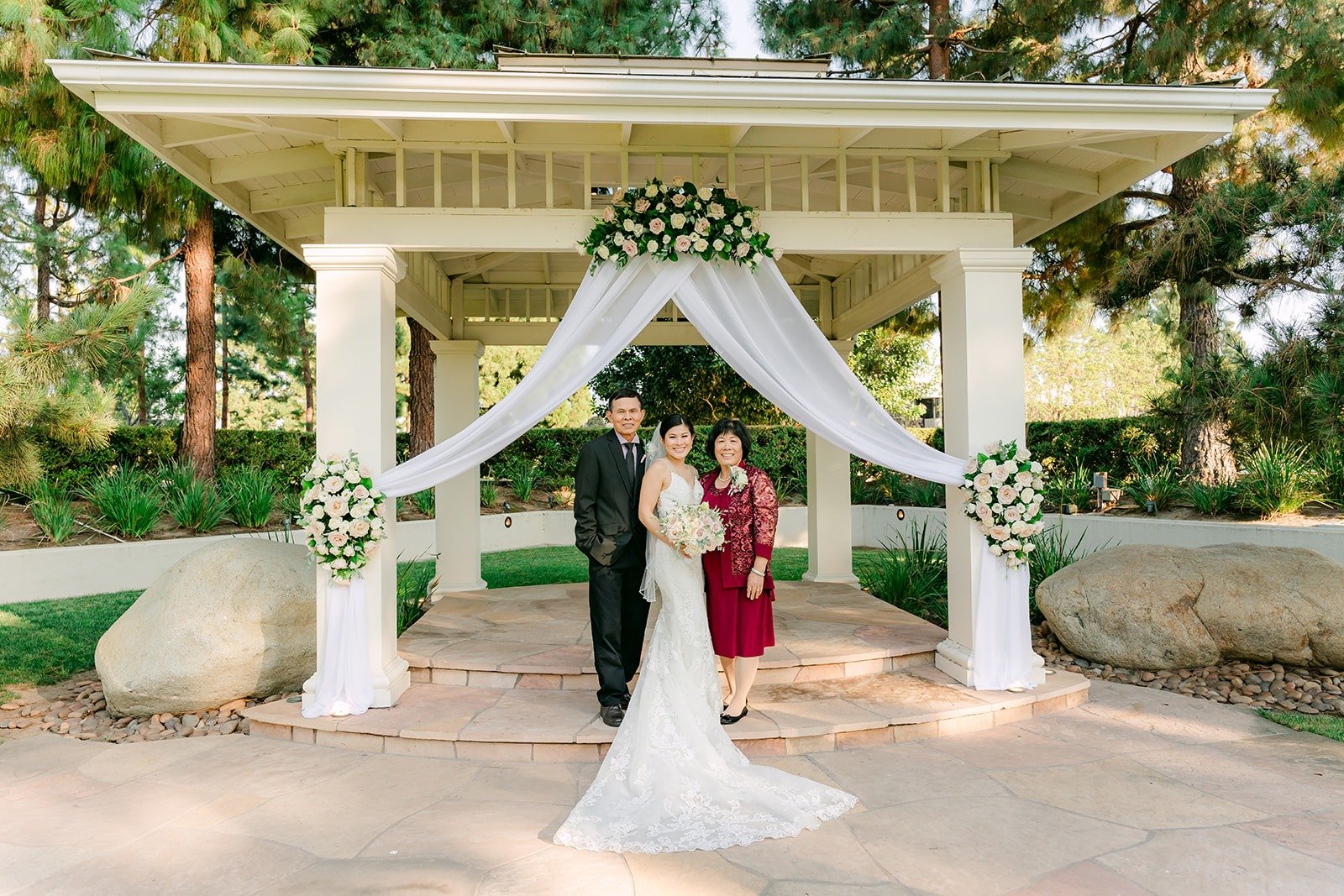 A wide view of the white gazebo set for the ceremony