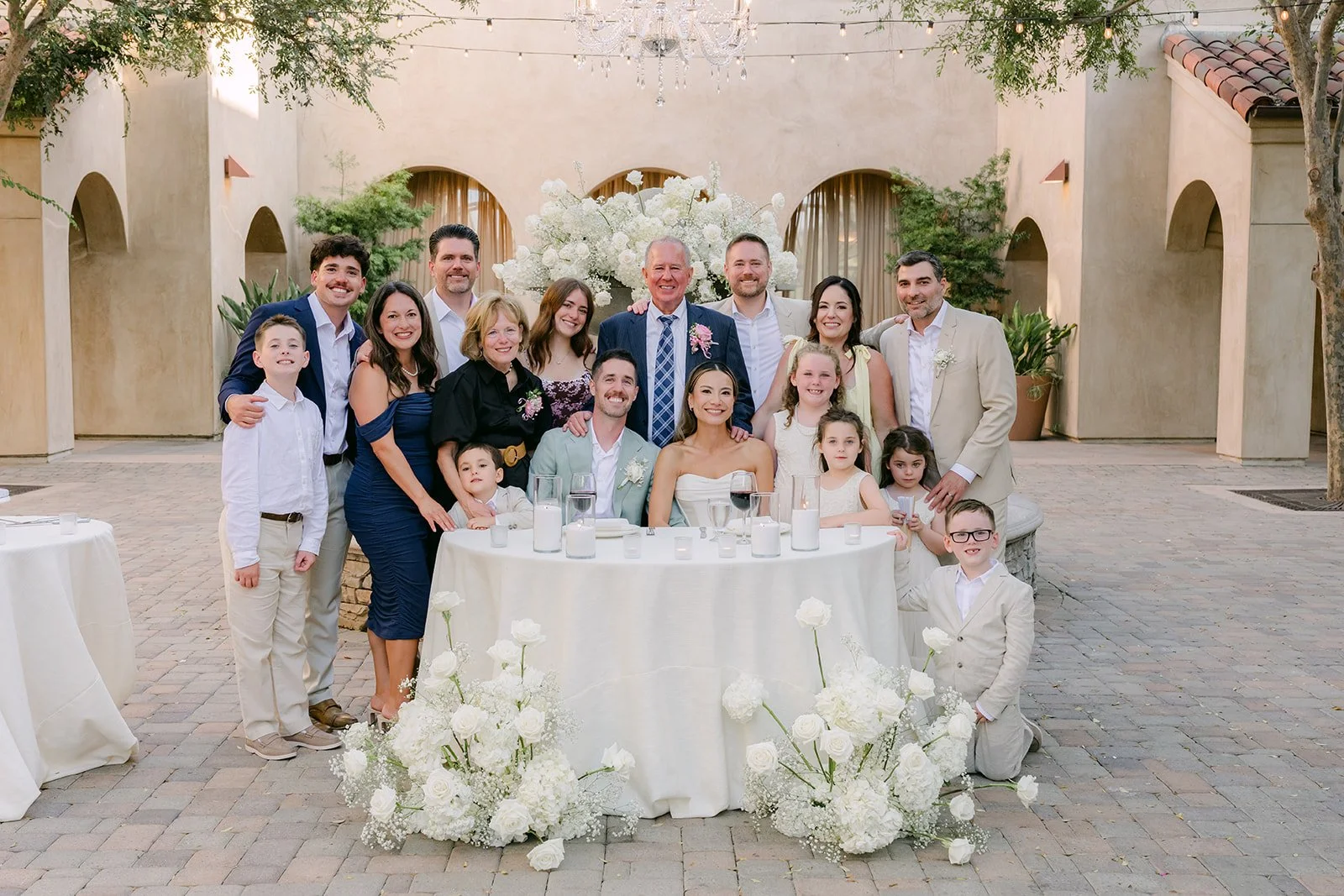 Kieu and Anthony with family at their table for table photos