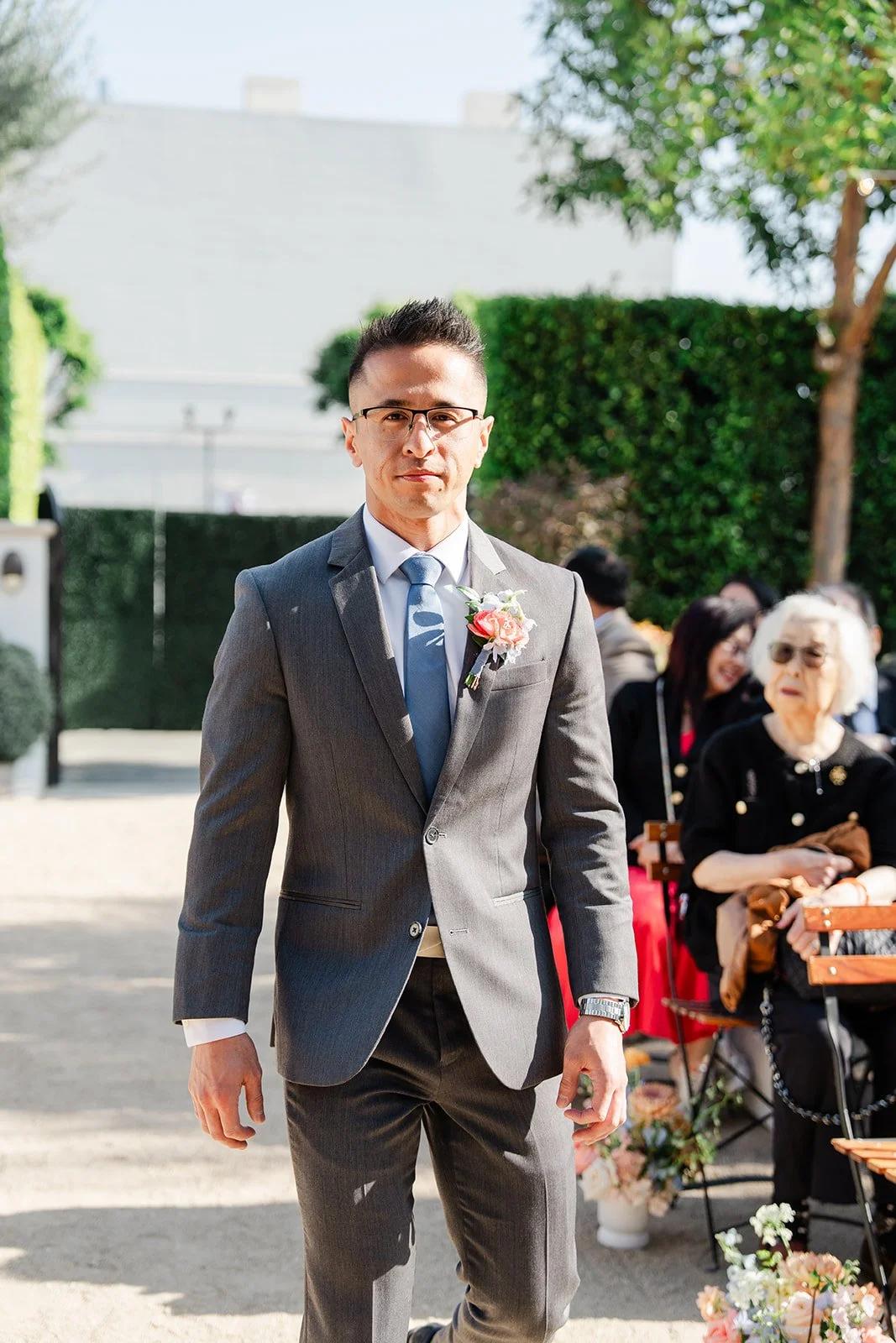 Groomsman walking down the aisle