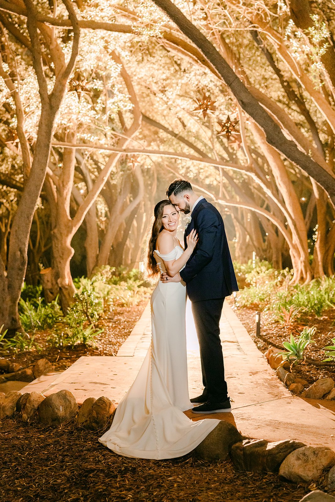 Mariana and Danny under the olive trees at night