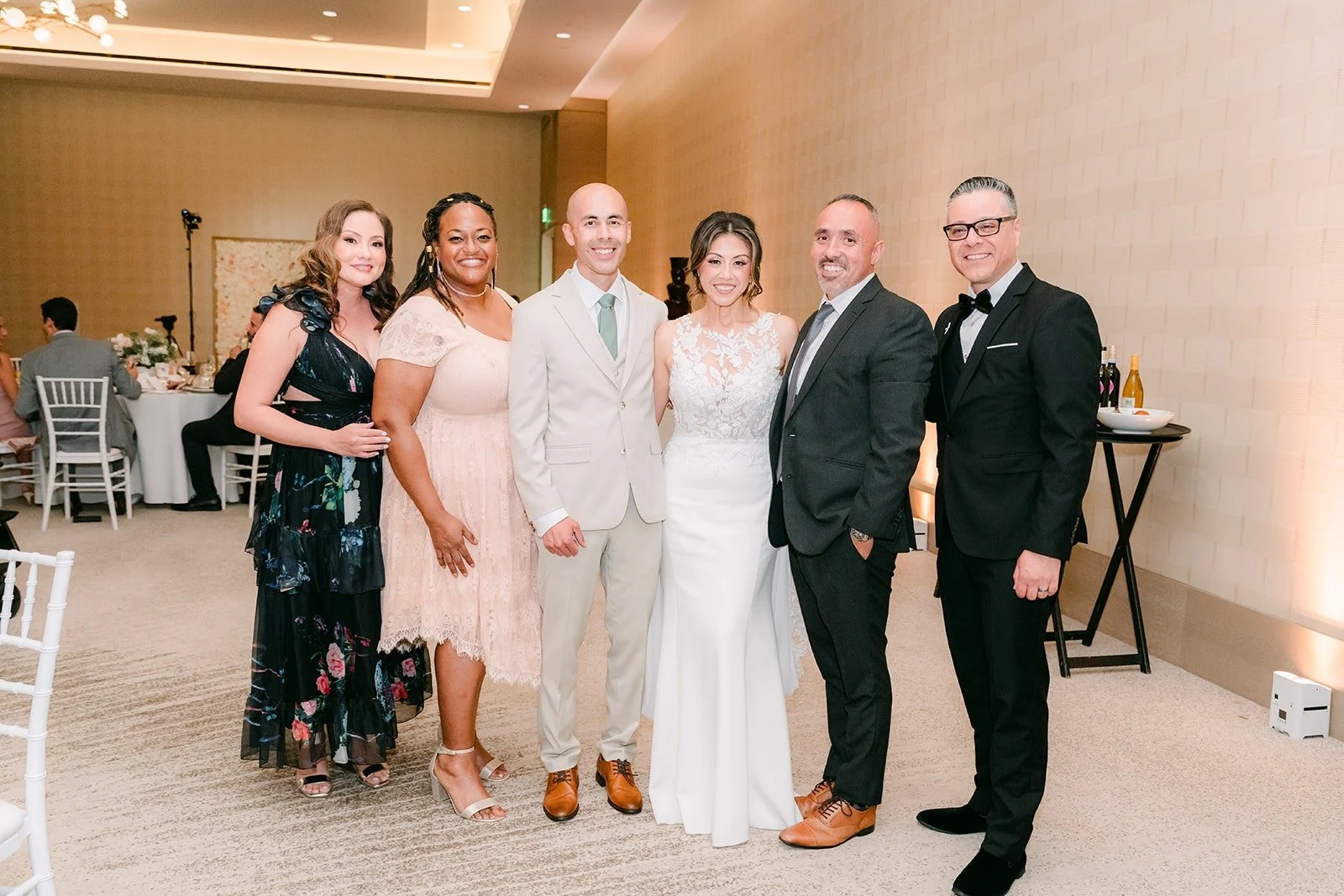 Francesca and Daniel pose with guests during dinner, photographed by One and Only Production