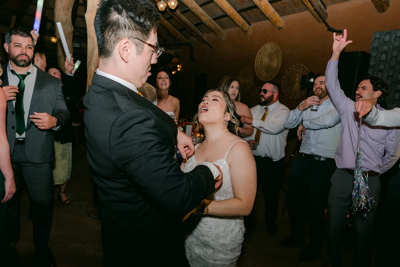 Guests cheering around Joanne and Zach on the dance floor