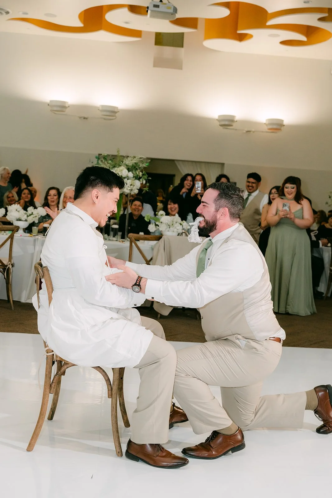 Cody removing Fernanda's garter.