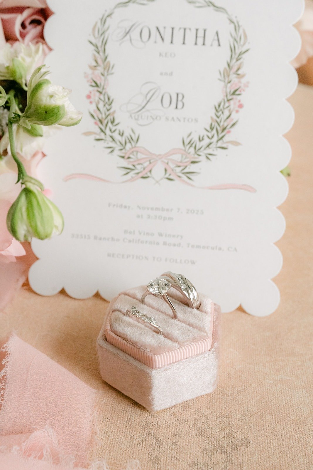 Konitha and Job's invitation propped beside the ring box
