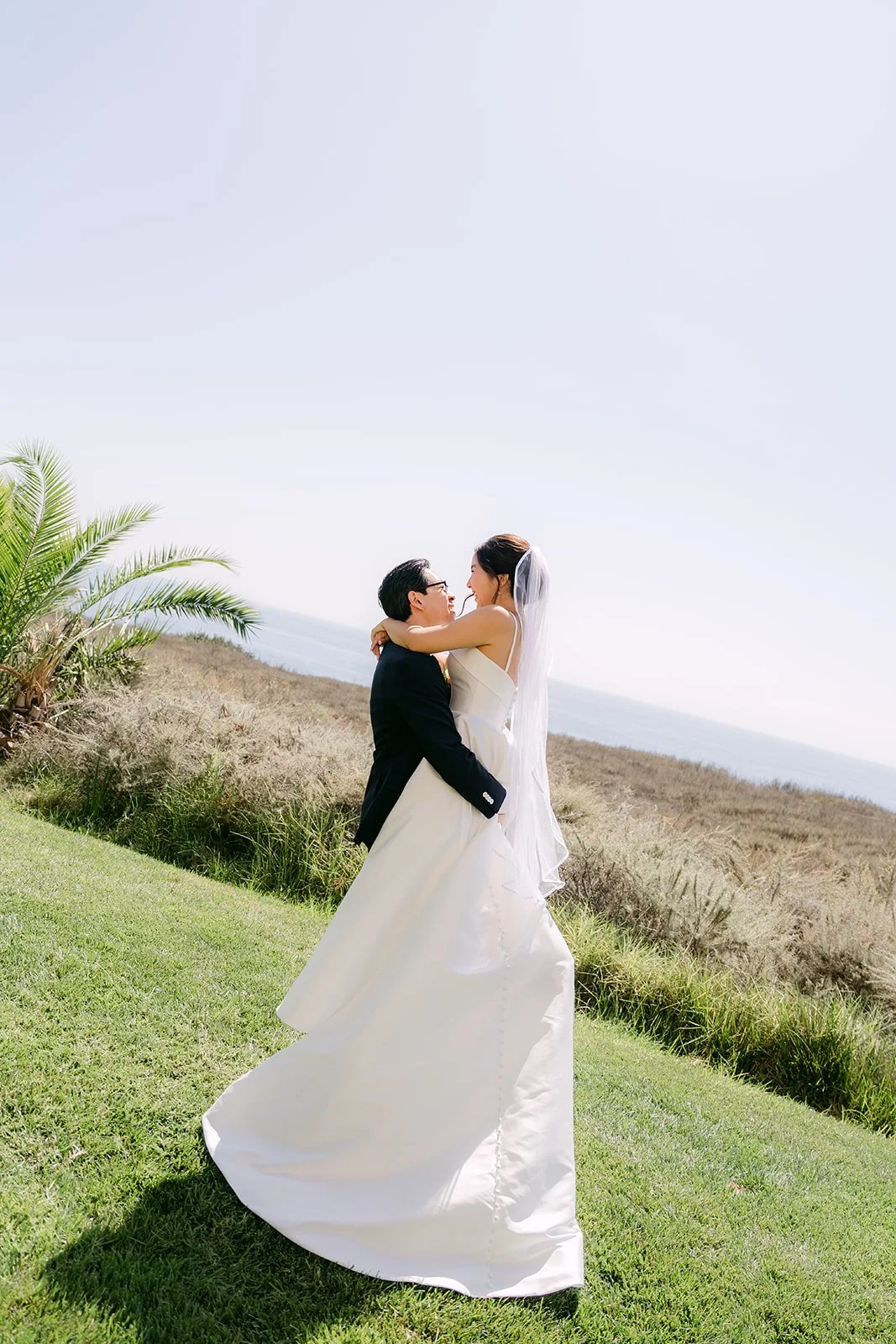A kiss on the coastal bluff above the Pacific