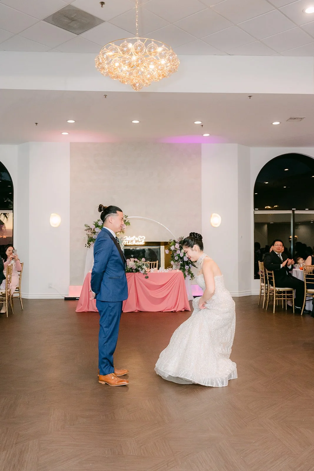 Kate and Michael beginning their first dance under the chandelier.
