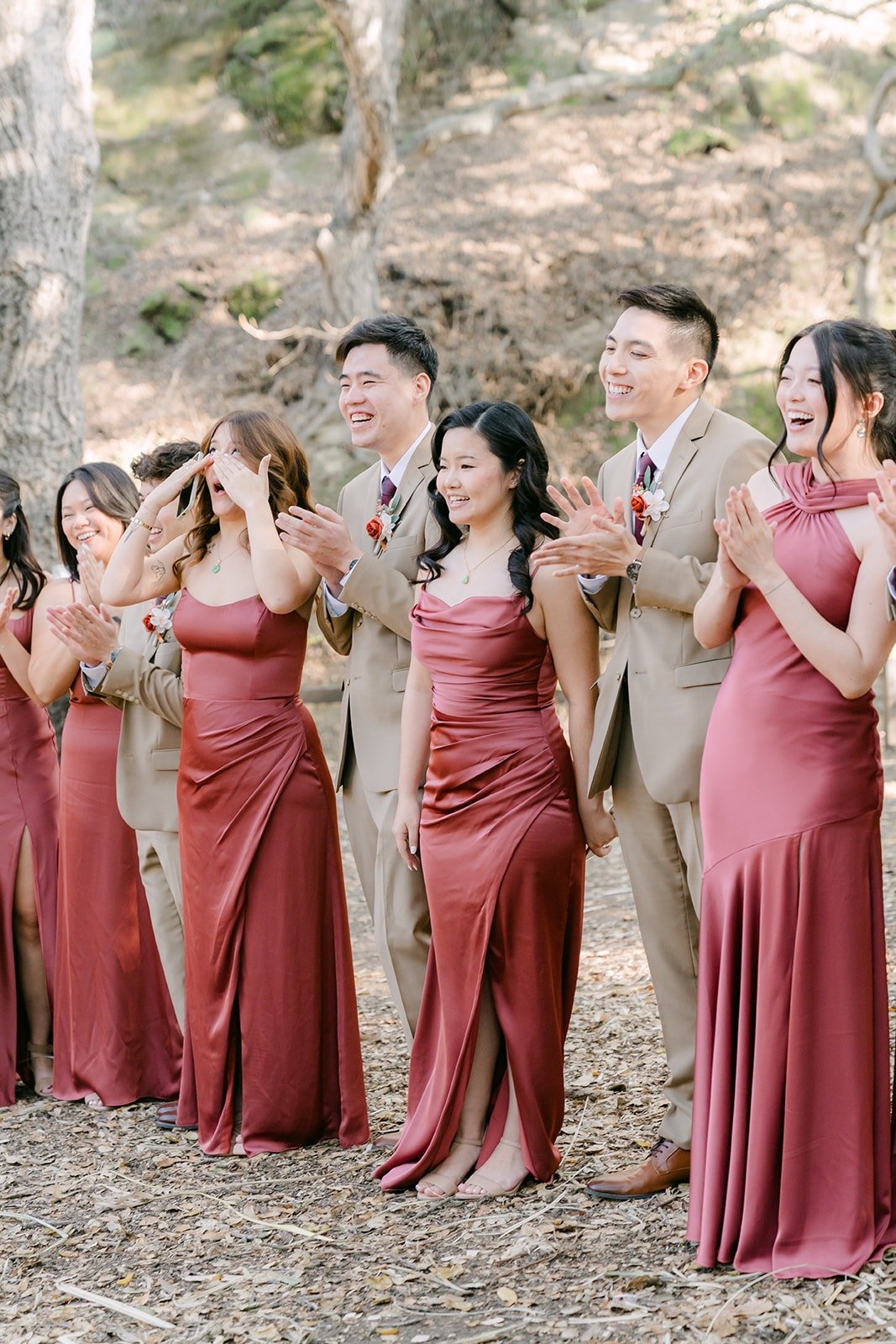 Bridesmaids in rose gowns react as Shayna joins them at Oak Canyon Nature Center