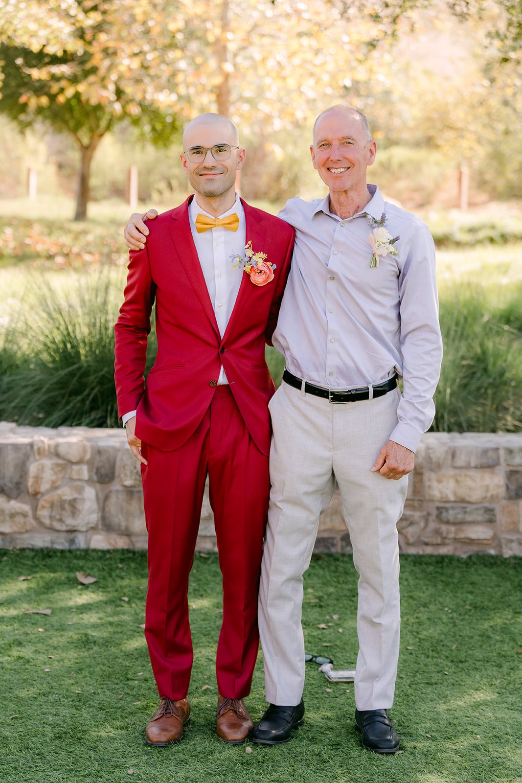 Christian with an older guest on the lawn after the ceremony.
