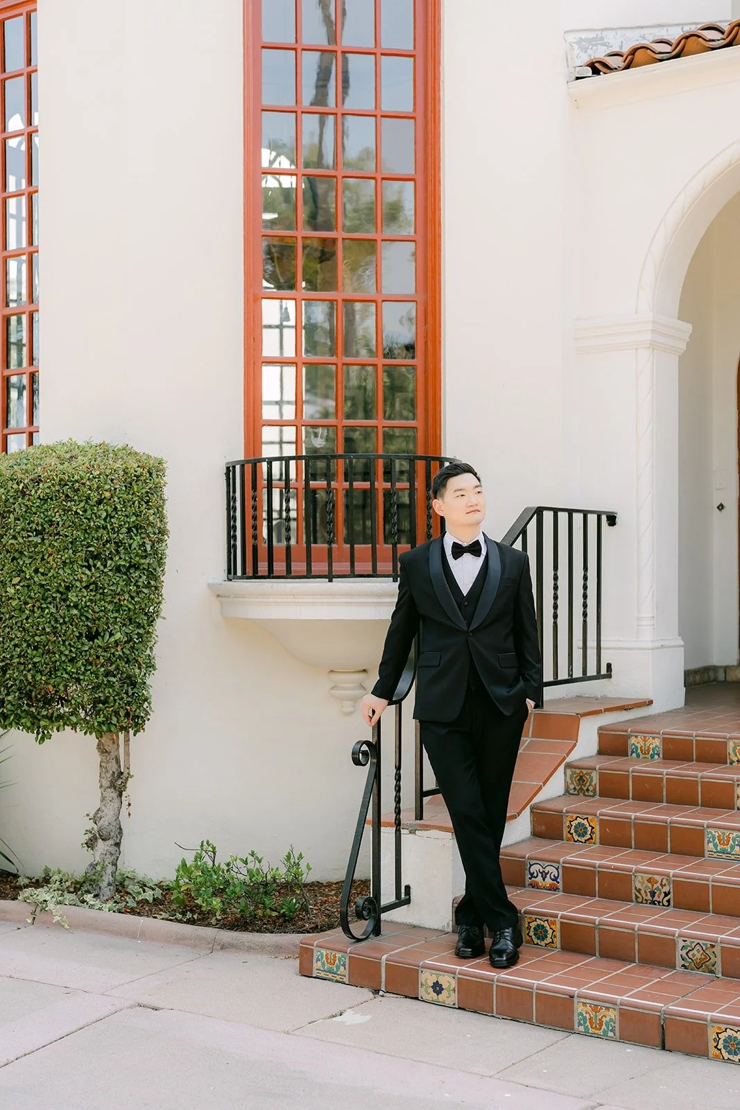 Sam on the red brick steps of the Muckenthaler mansion