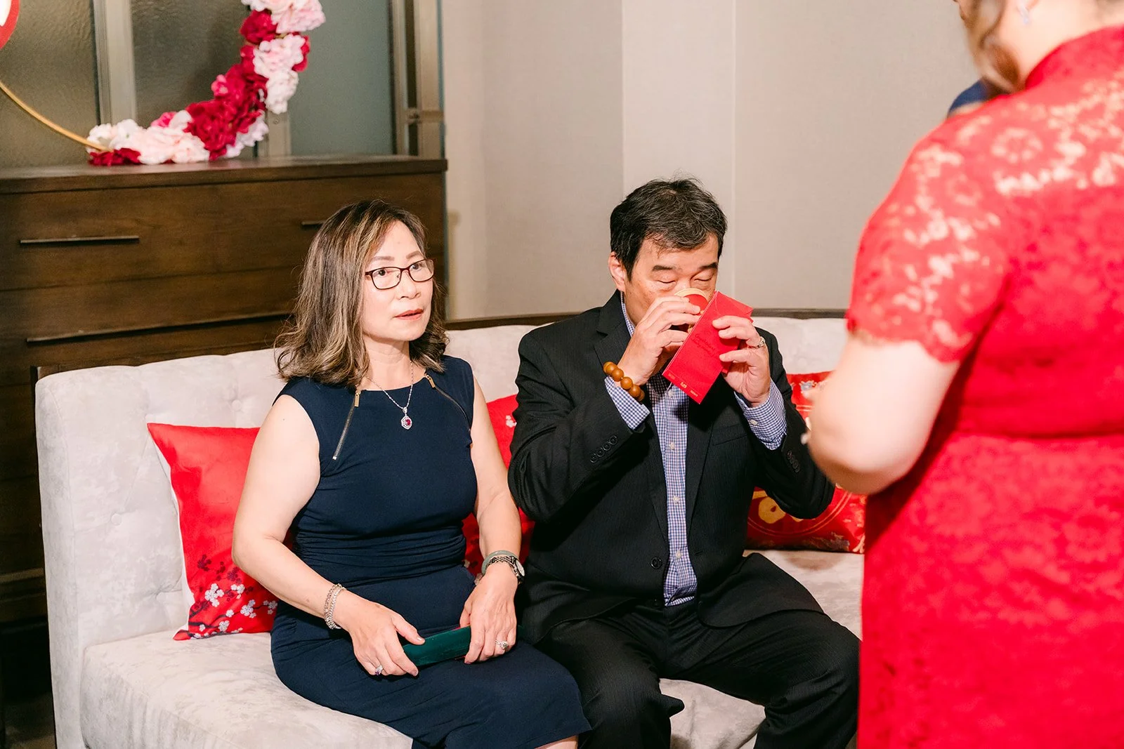 A relative sipping tea from the couple.