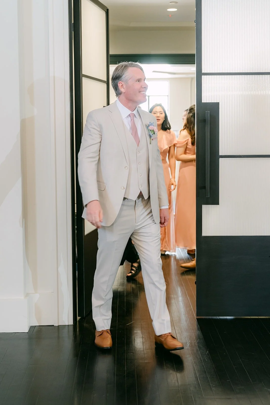 A member of the wedding party makes his grand entrance