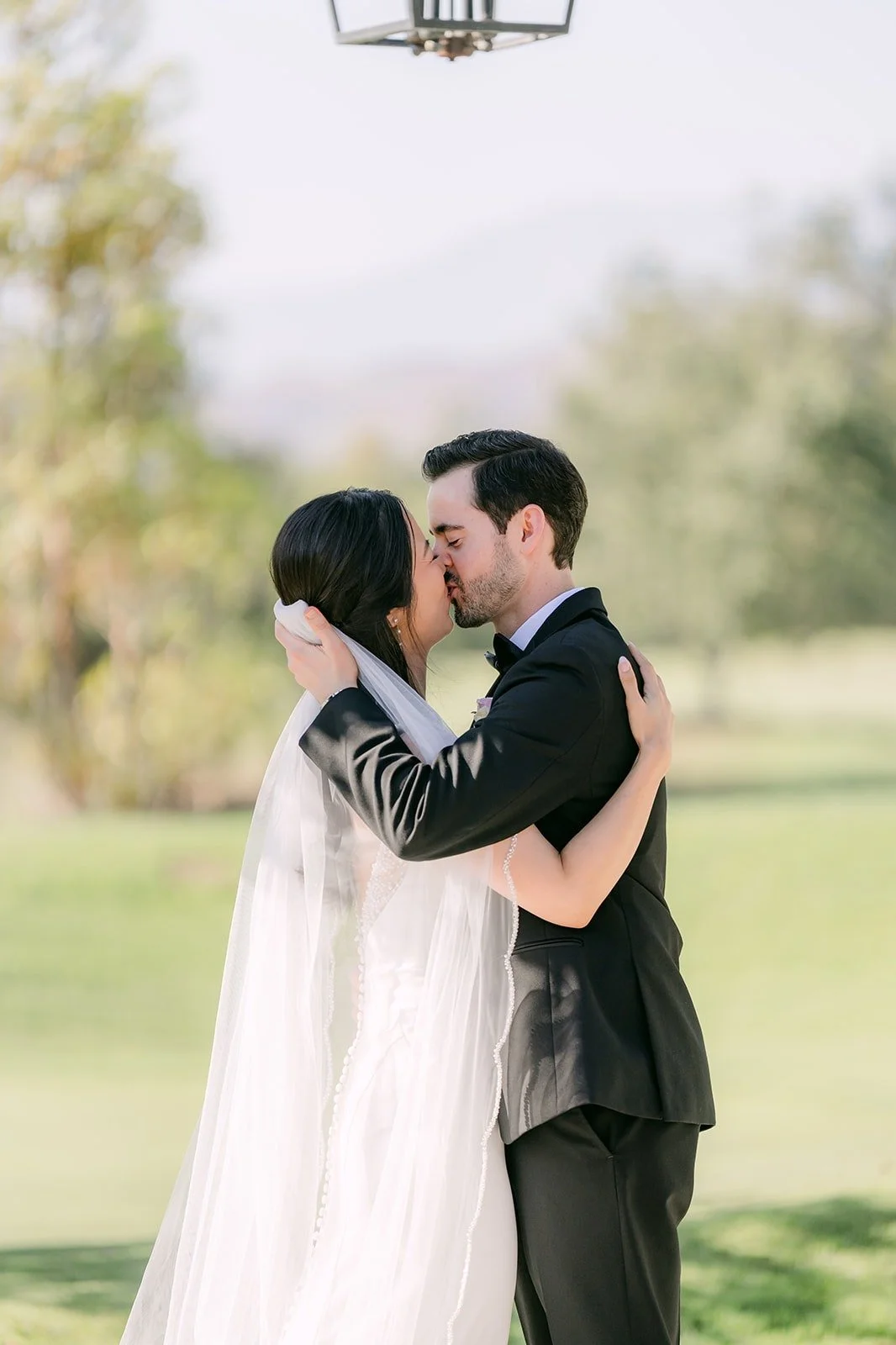 Stephanie and Kevin's first kiss as a married couple under the pagoda
