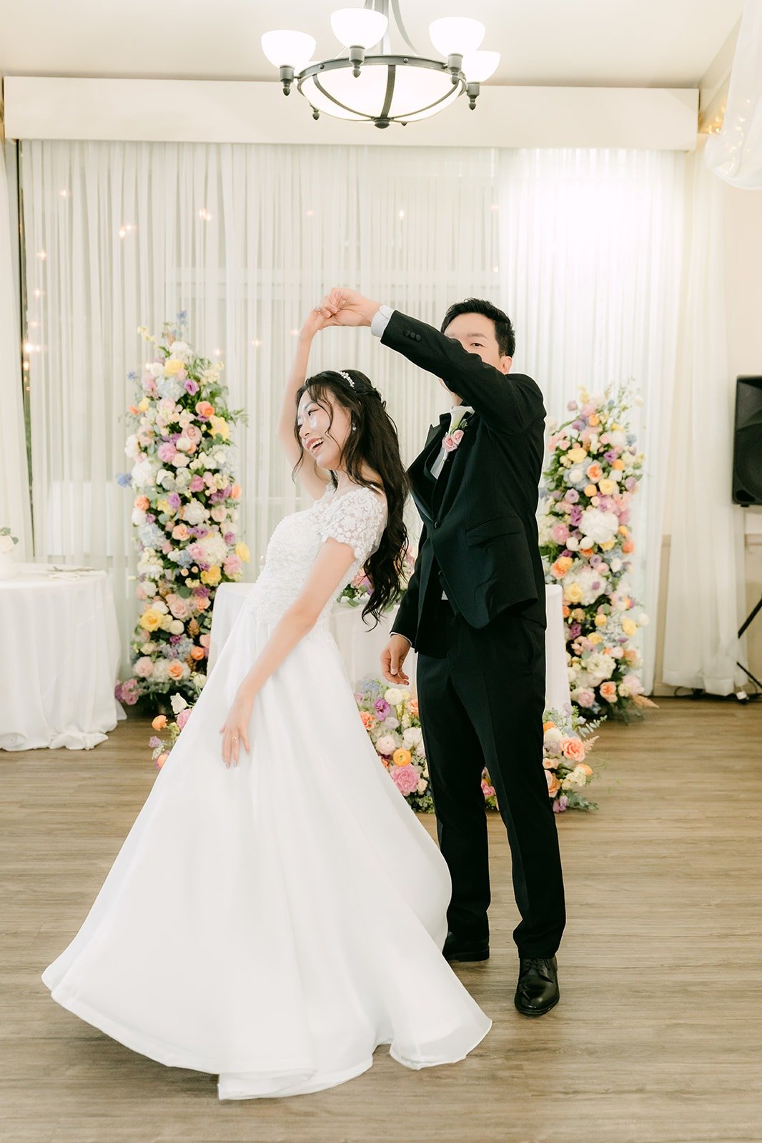 Eunsang spinning Jeannie under the chandeliers