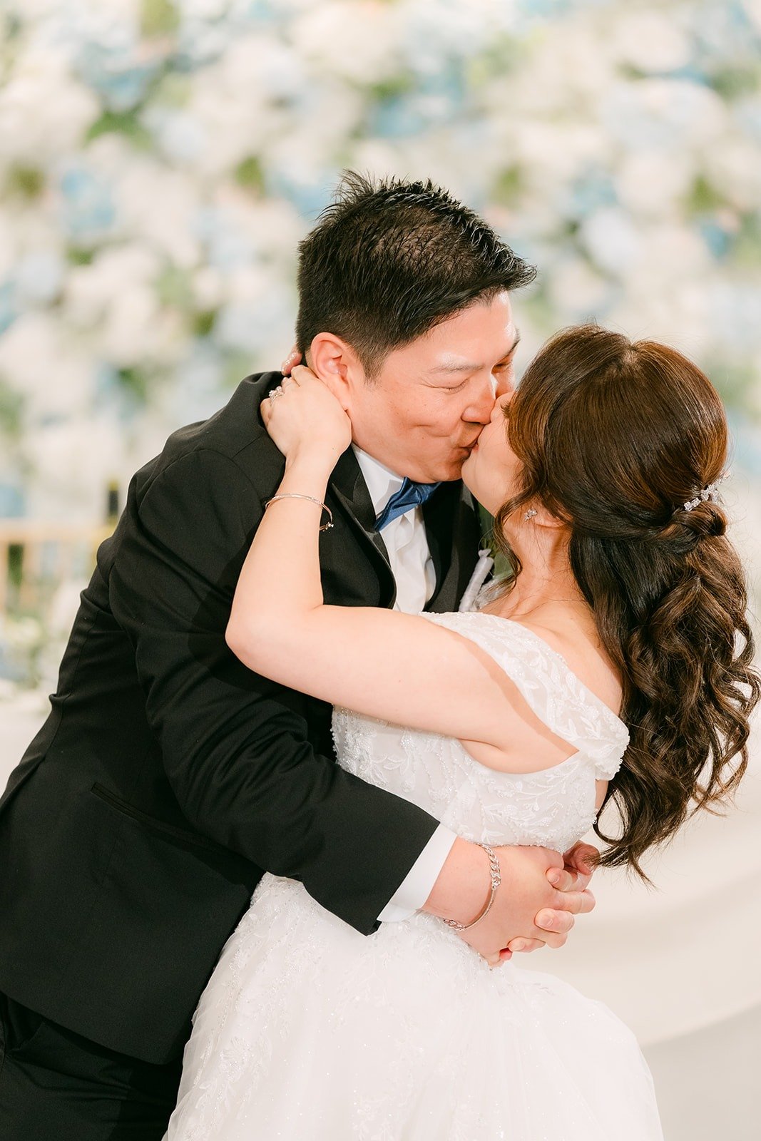 Jay kisses Sochi at the end of their first dance, photographed by One and Only Production