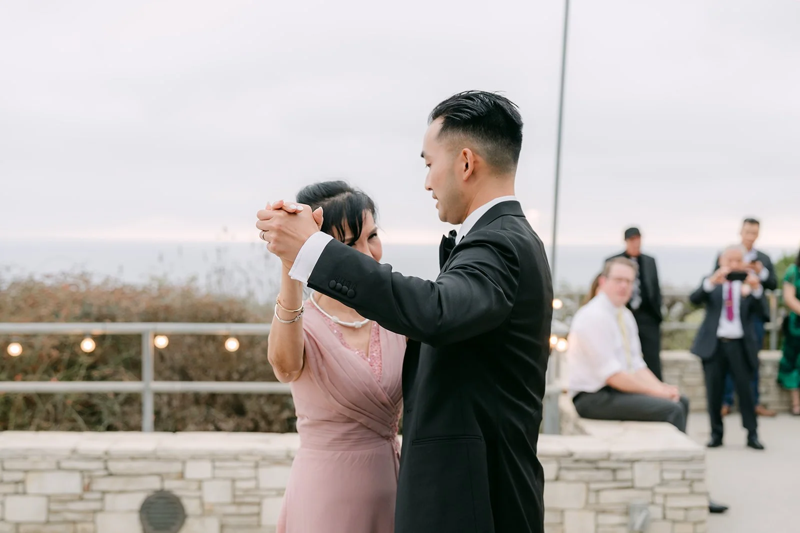 Vincent dancing with his mom on the reception patio
