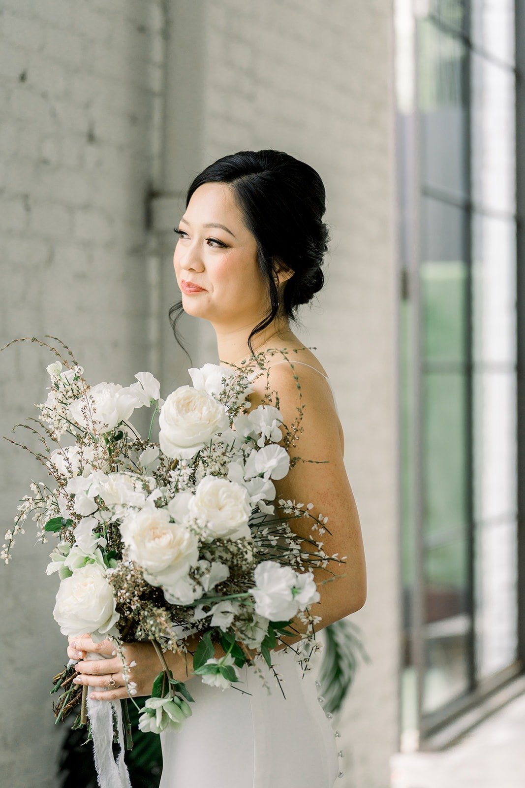 Cindy in profile with her bouquet