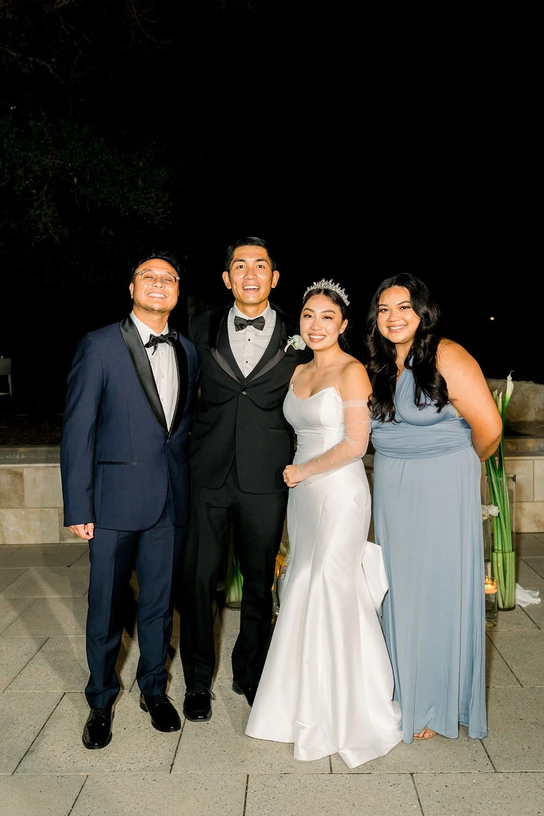 Steven and Jacinda with friends on the patio at night
