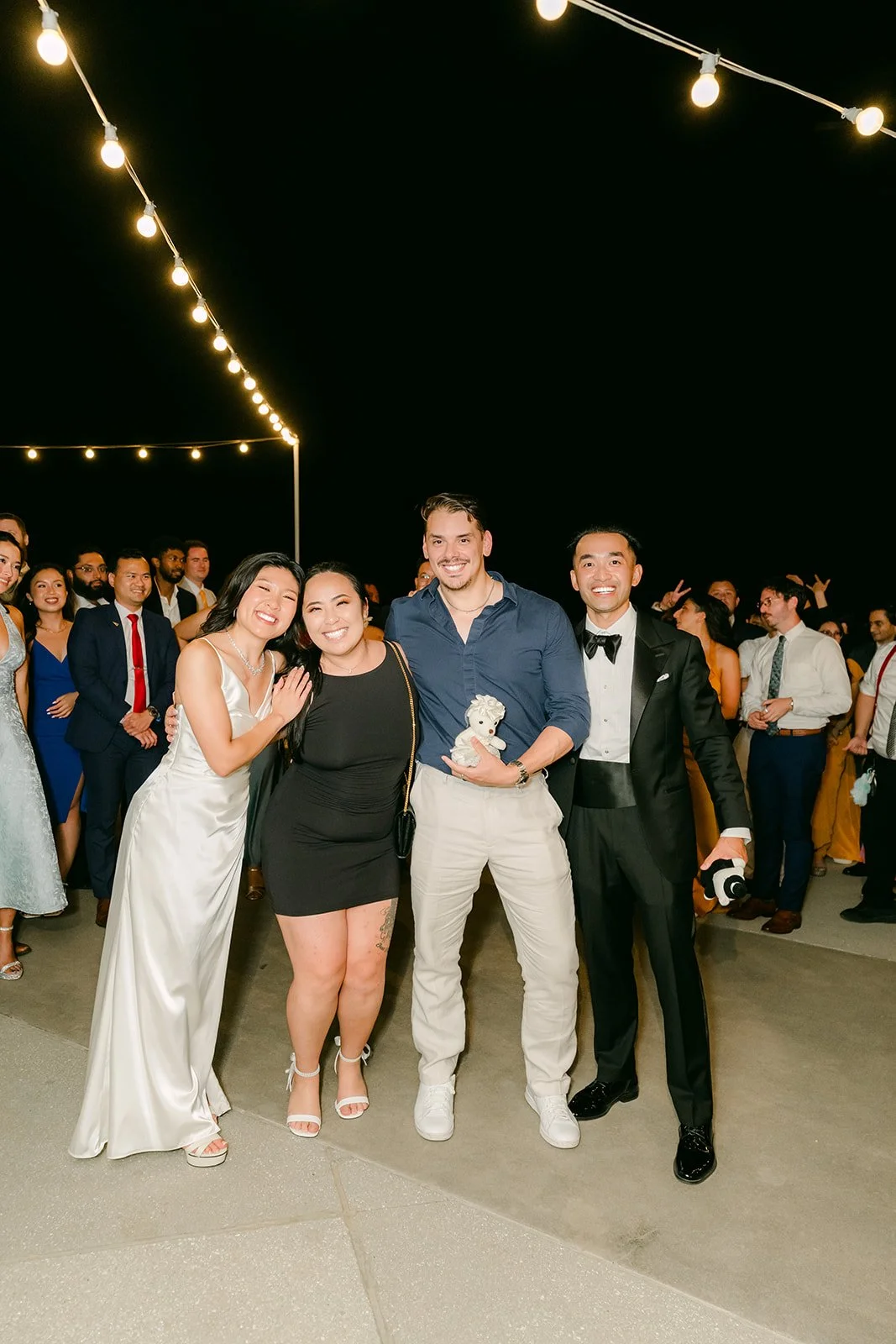Guests celebrating the bouquet toss