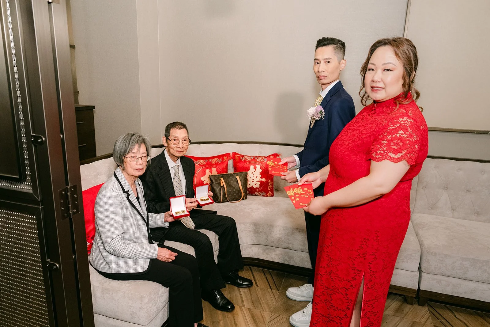 Mai and Bobby serving tea, wide view of the suite.