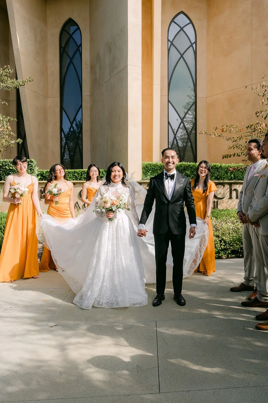 Wedding party in front of St. John Fisher Church