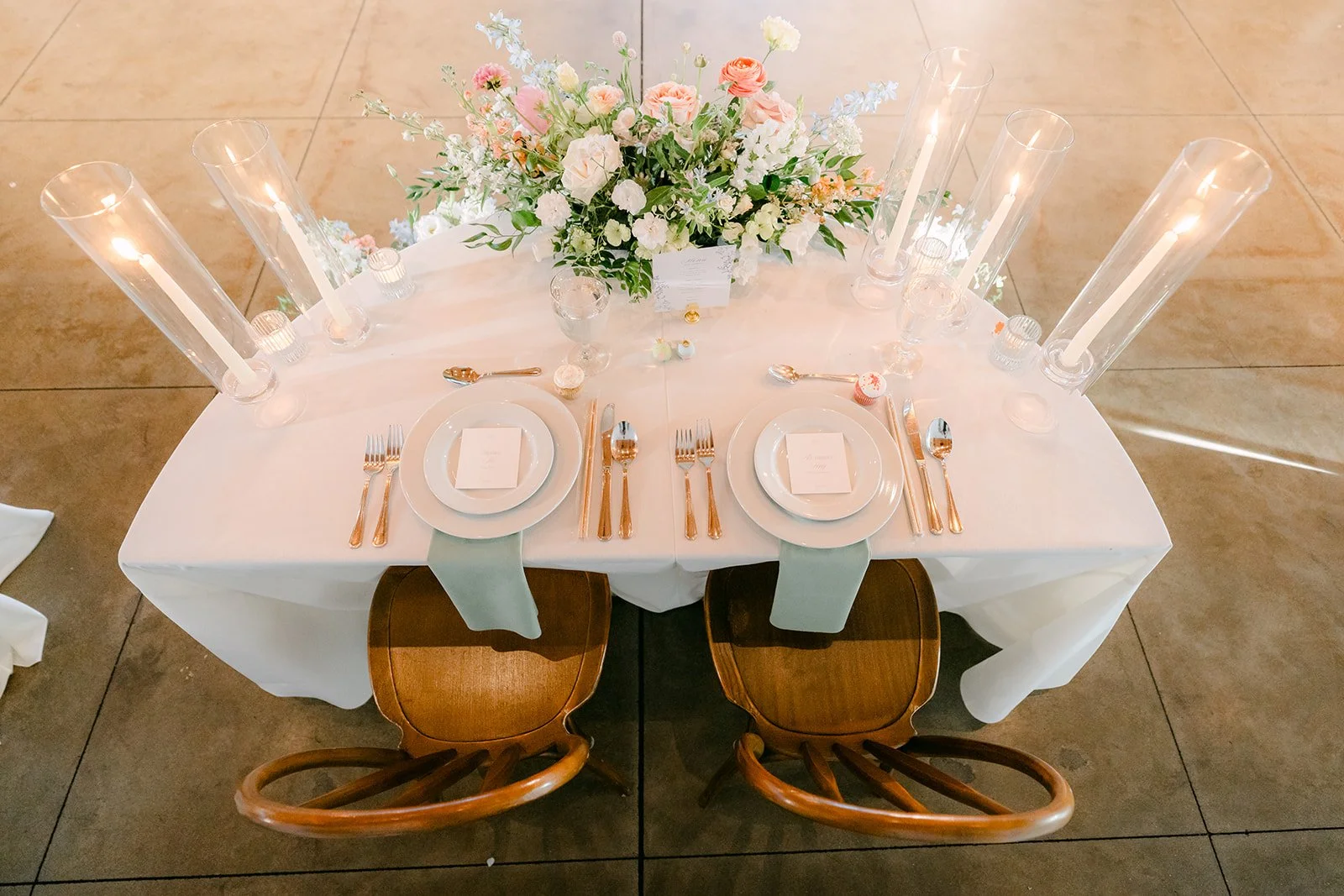Sweetheart table setting with wishbone chairs