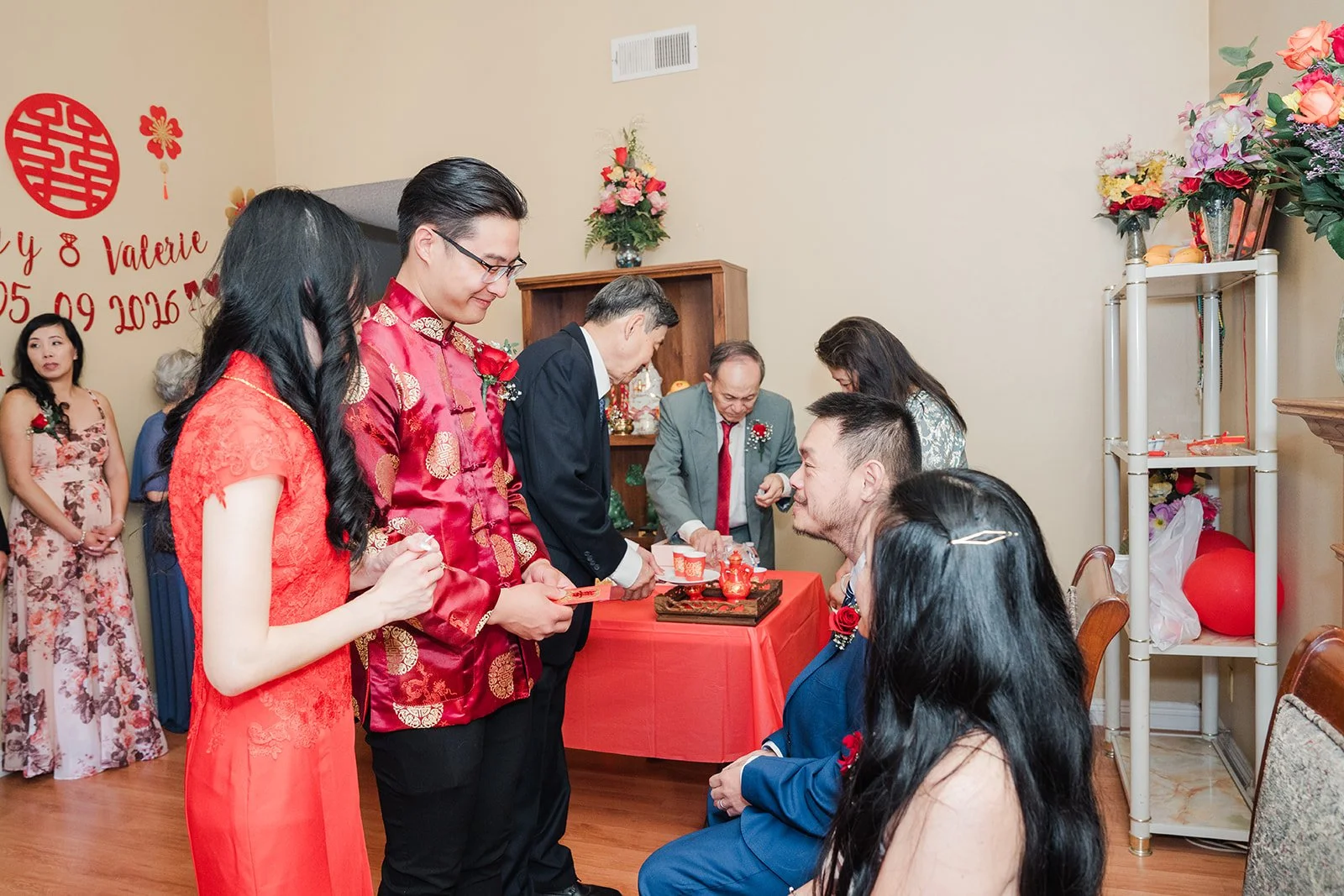 Valerie and Danny serving tea to relatives.