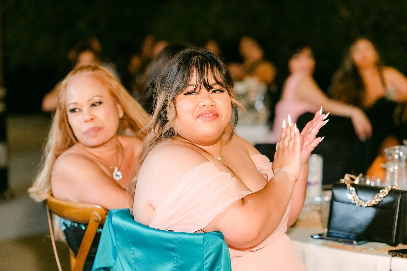 Bridesmaids laughing during the speeches
