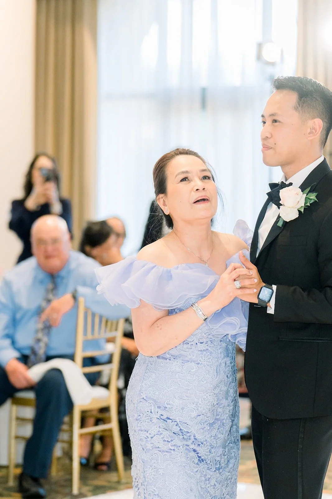 Ralph dancing with a family member in a lavender gown, photographed by One and Only Production