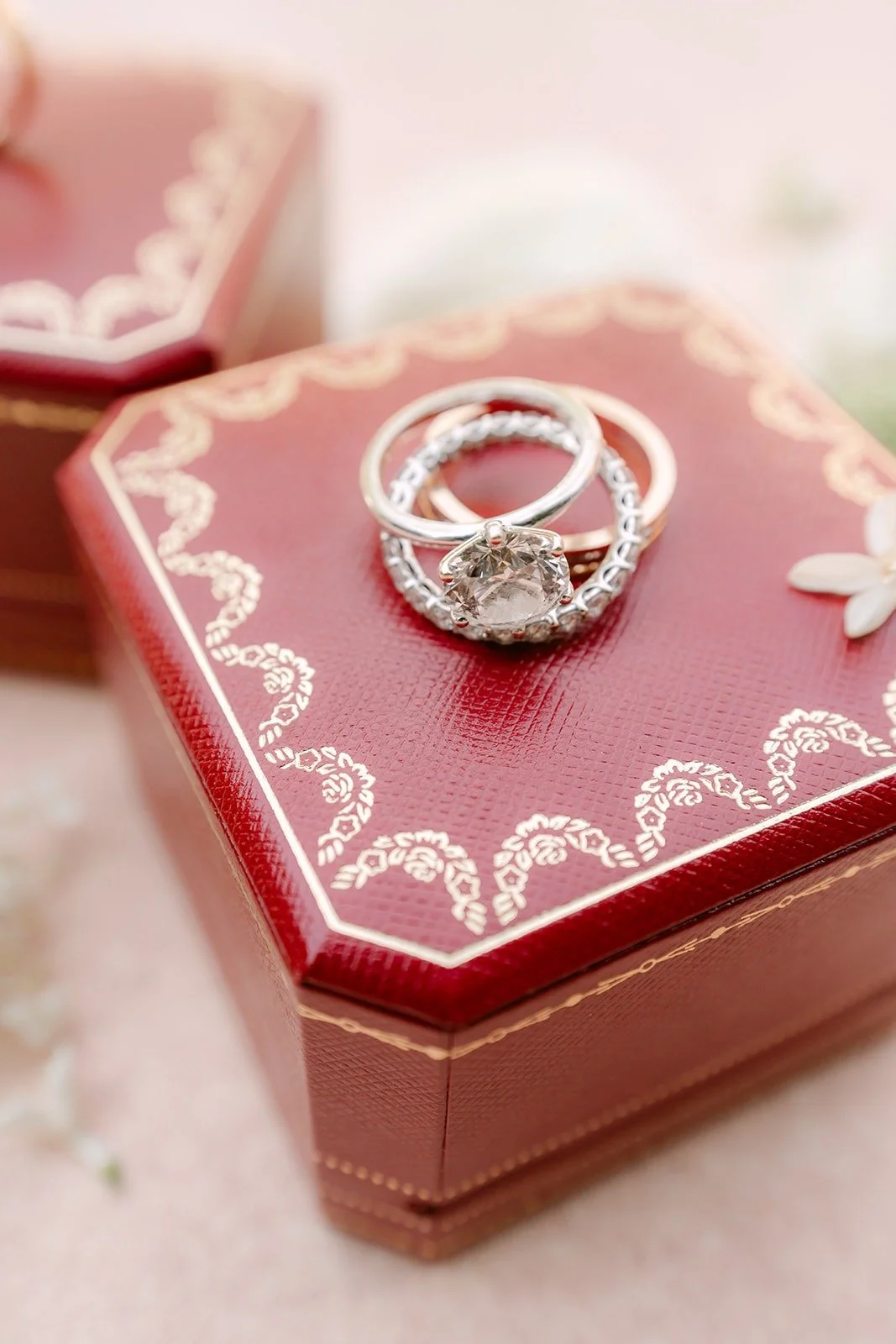 Chorok's engagement ring in an open red ring box, photographed by One and Only Production