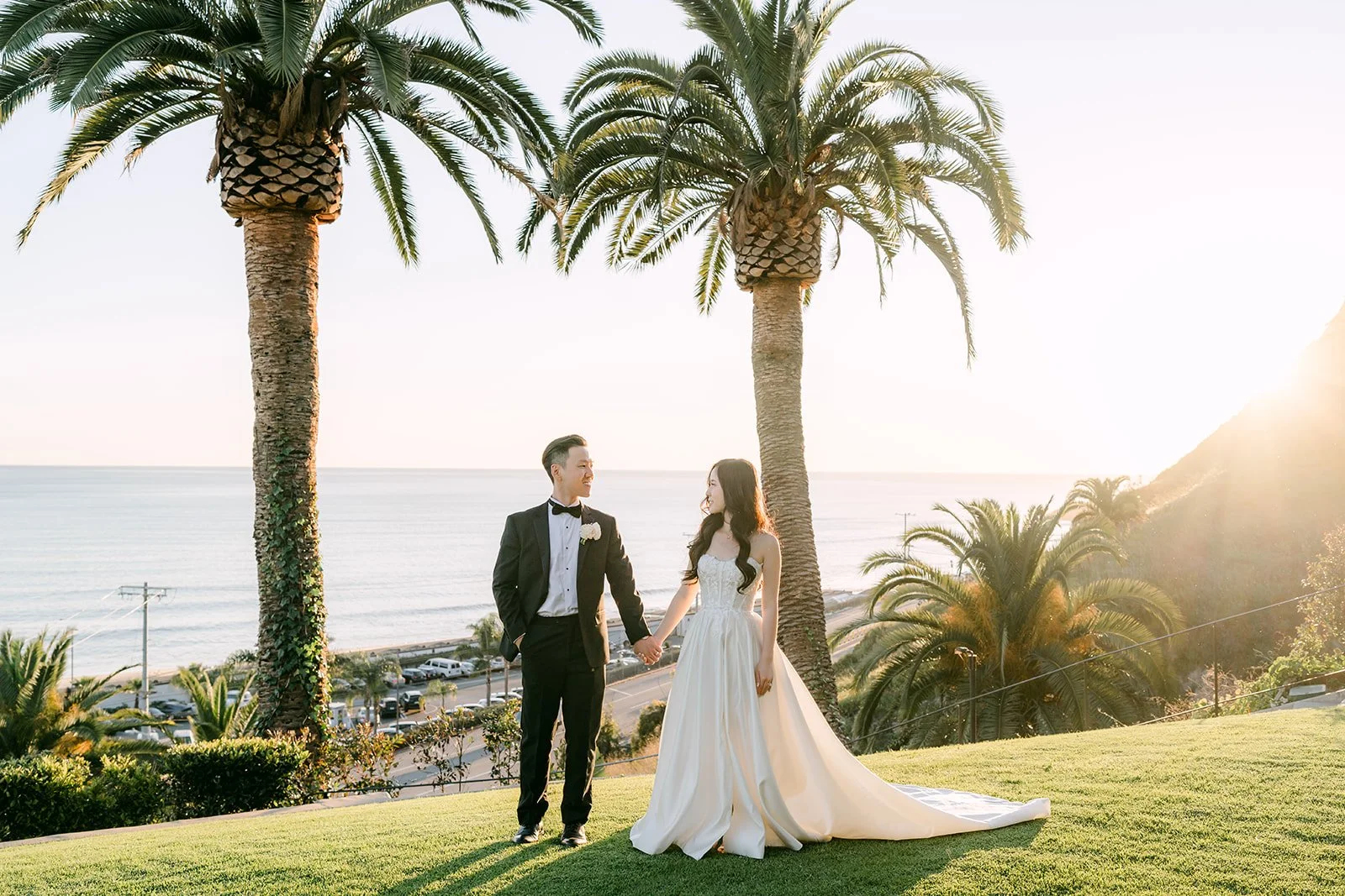 Kelley and Kai walking the lawn at golden hour