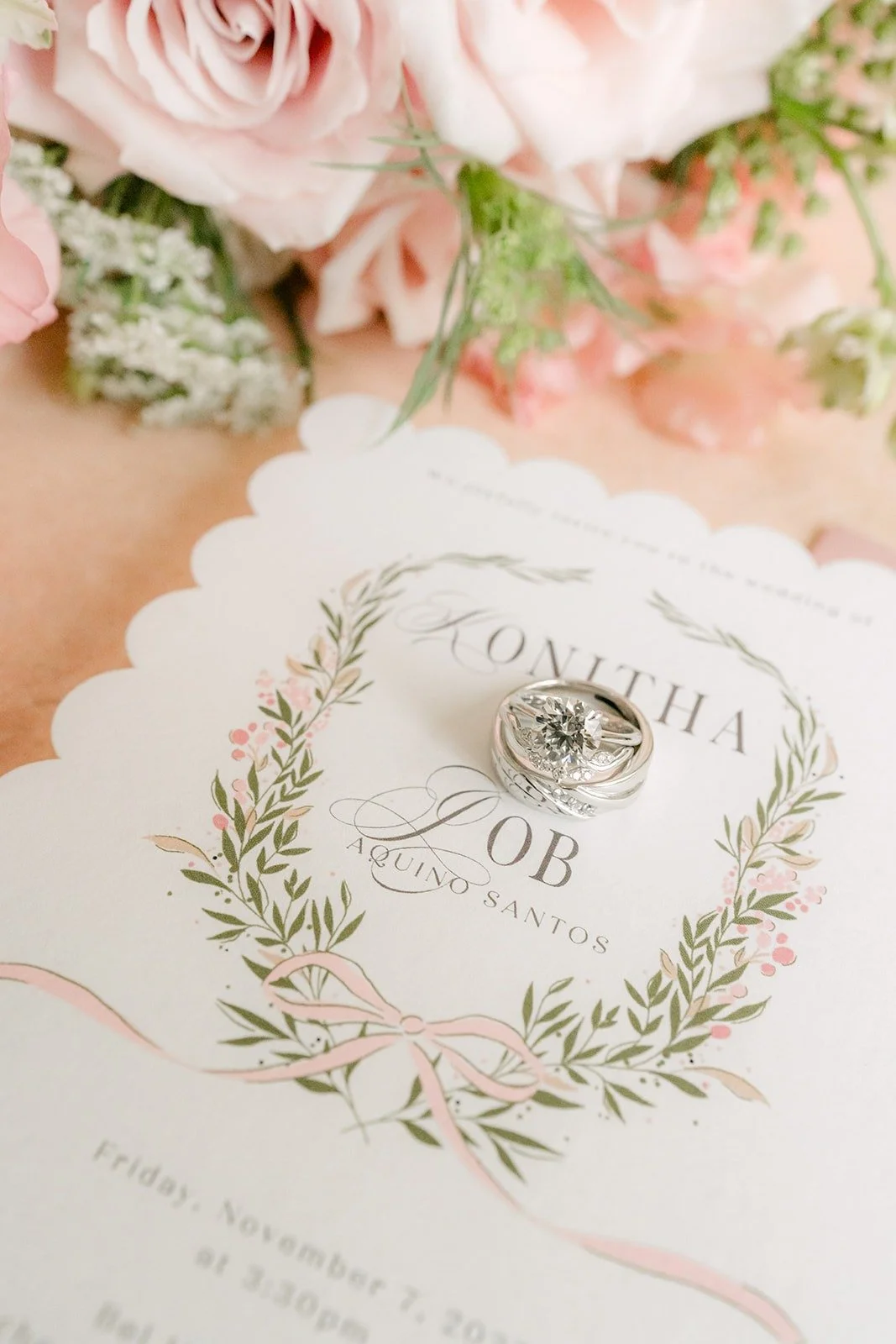 Close up of Konitha and Job's names on the laurel invitation
