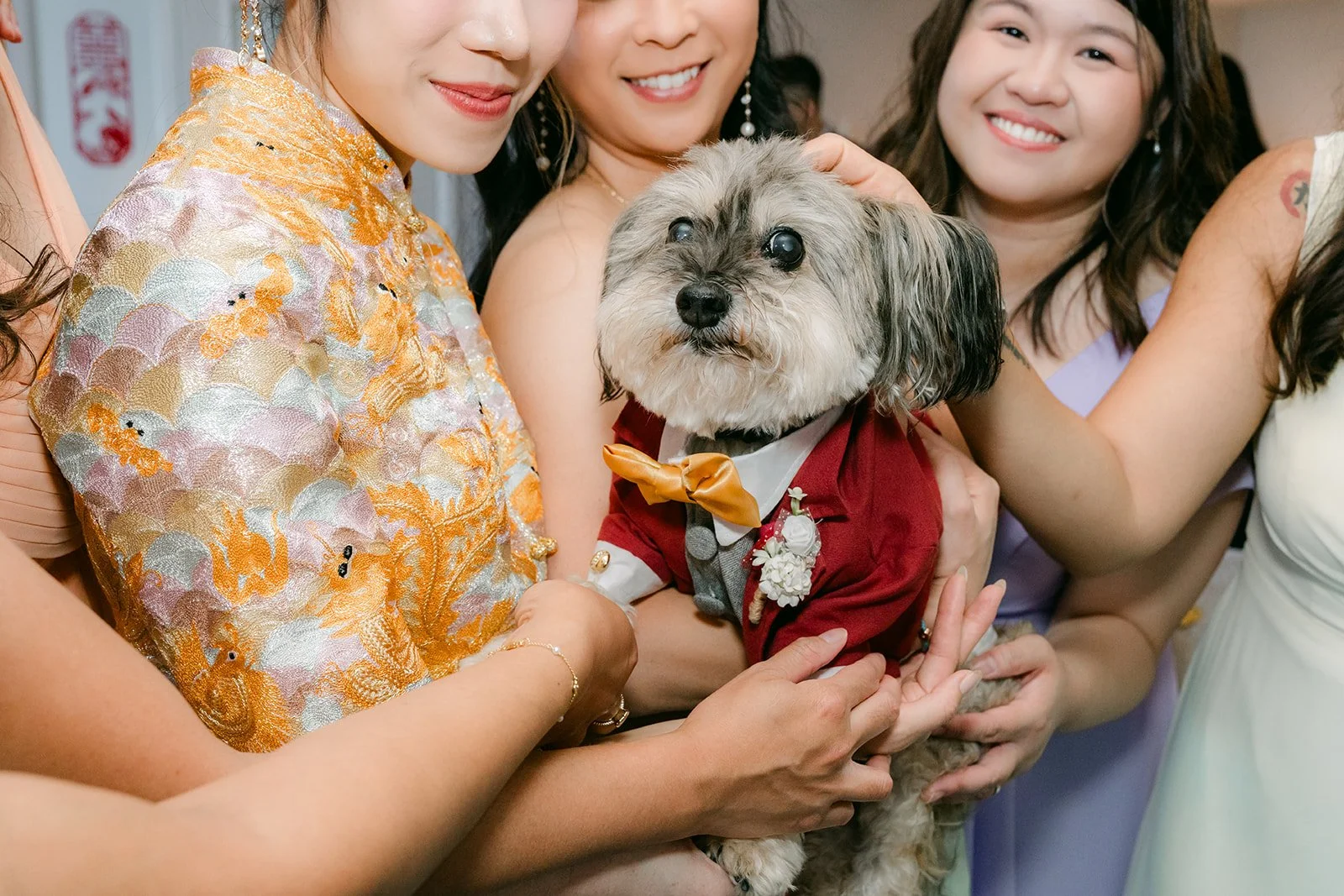 Christie's bridesmaids crowd around Izzo for a playful photo, photographed by One and Only Production.
