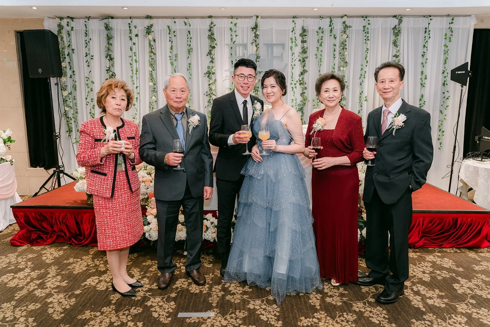 Eunice and Eric with family during table greetings