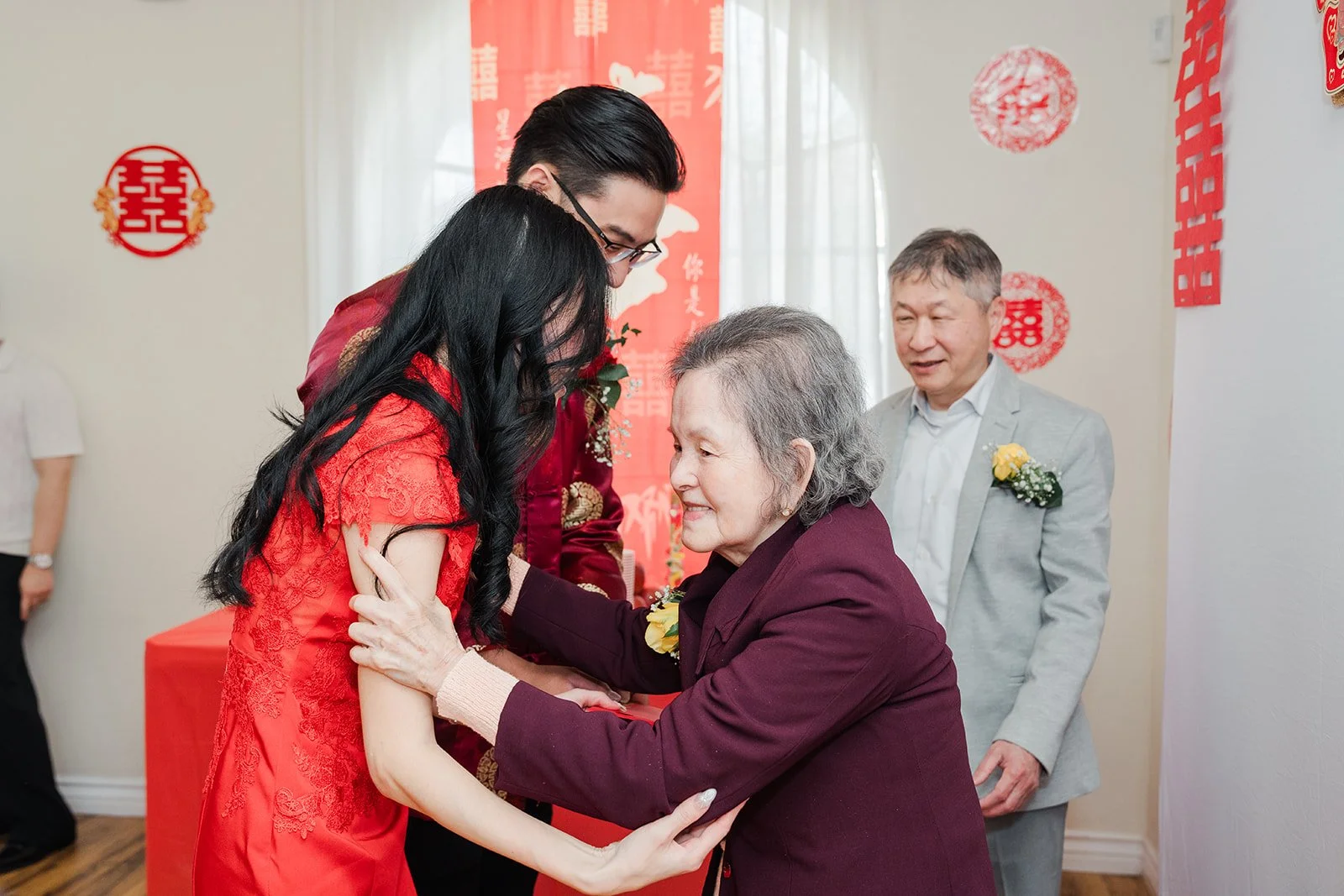 Valerie hugging an elder during the tea ceremony.