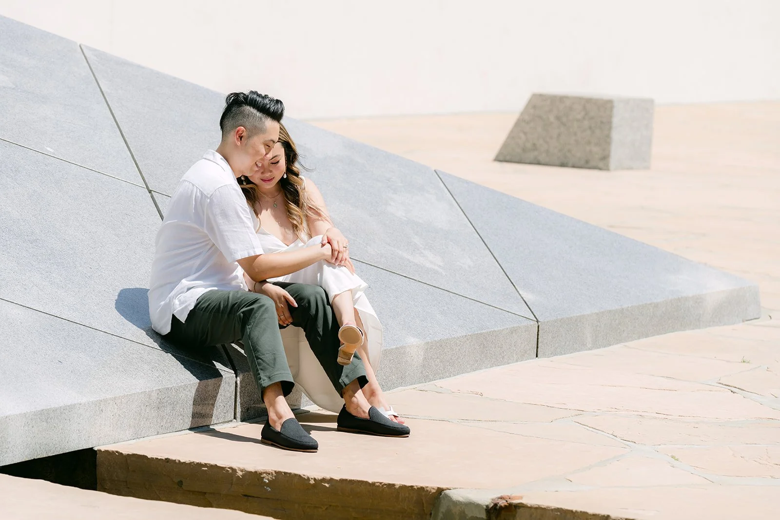 Stephanie and Alan sitting together on the edge of the pyramid.