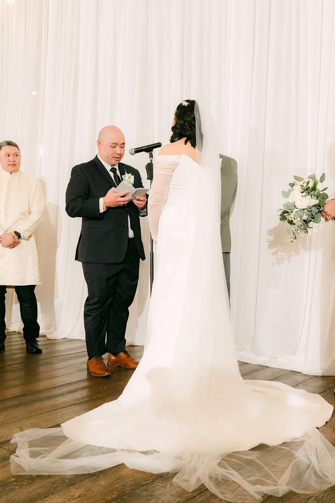Vivian and Yao at the front of the ceremony with officiant Dave Davenport