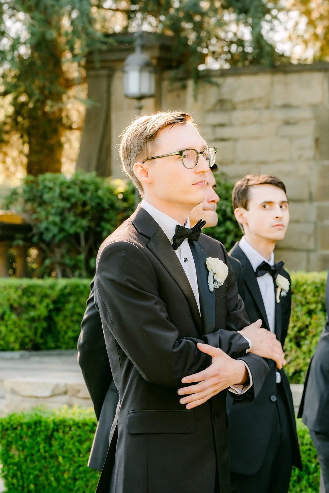 Nik watching Brianna come down the aisle