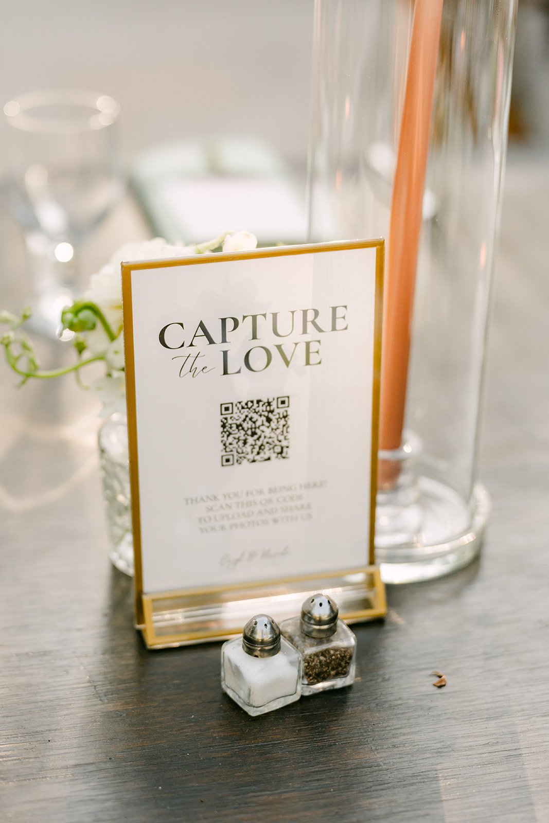 Capture the Love QR code sign on a guest table.
