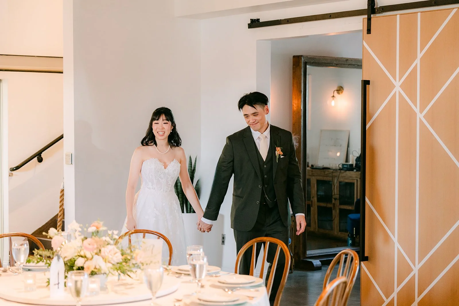 Vivian and Alex walking into the Great Hall for the room reveal